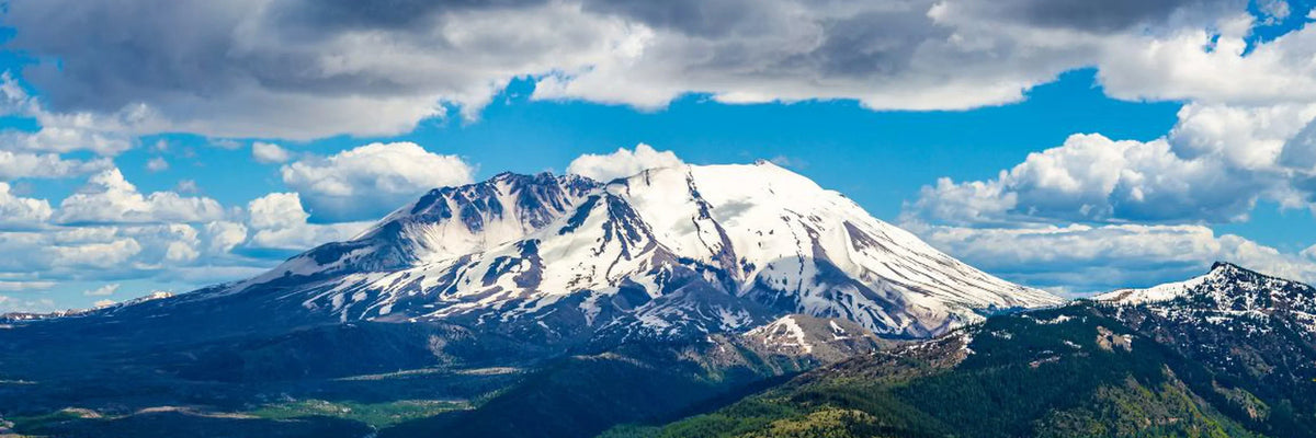 Snow-capped Cascade Range peaks with forests in national parks