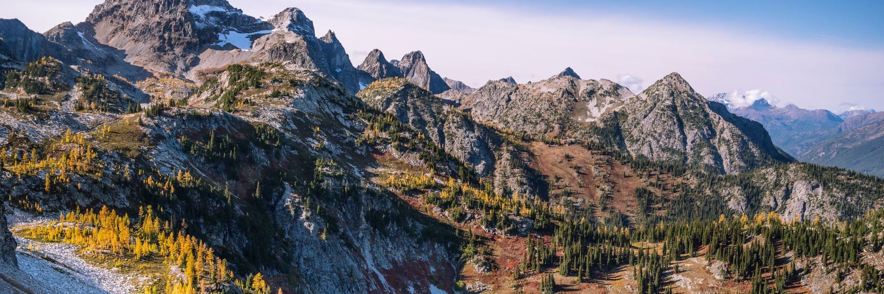 Rugged North Cascade peaks with autumn foliage and evergreens