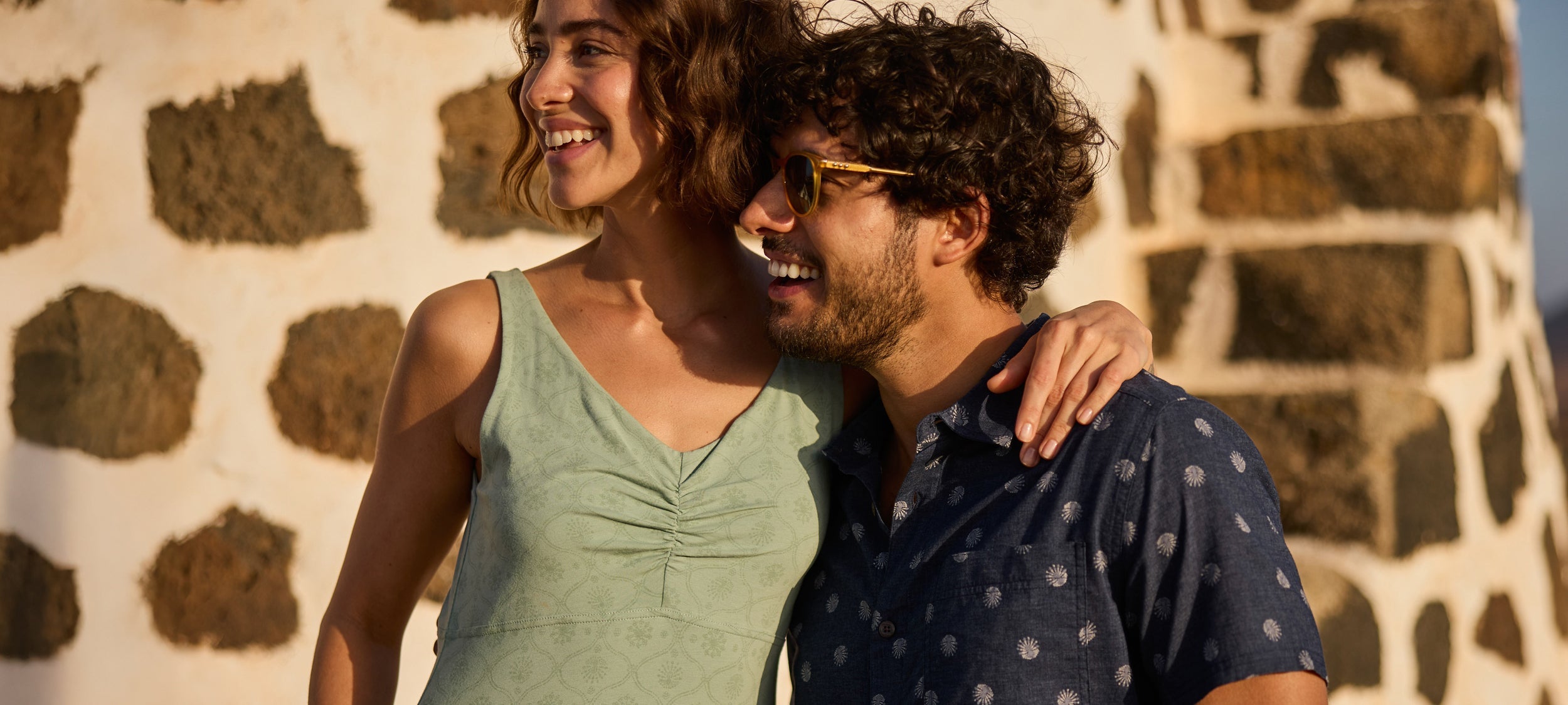Woman in light green sleeveless v-neck dress with ruching in patterns article