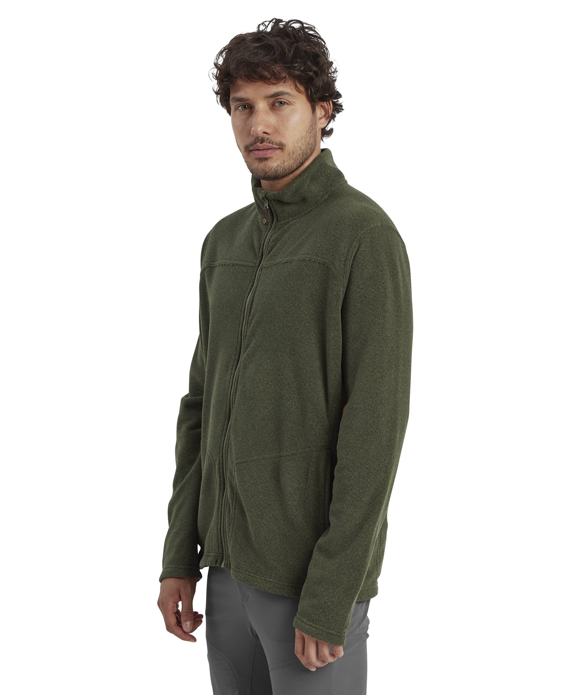 A side-angle portrait of the man wearing the Sherpa Adventure Gear Rolpa Eco Jacket in Green. The focus is on the jacket’s clean design, showing its form-fitting cut and structured shoulders.
