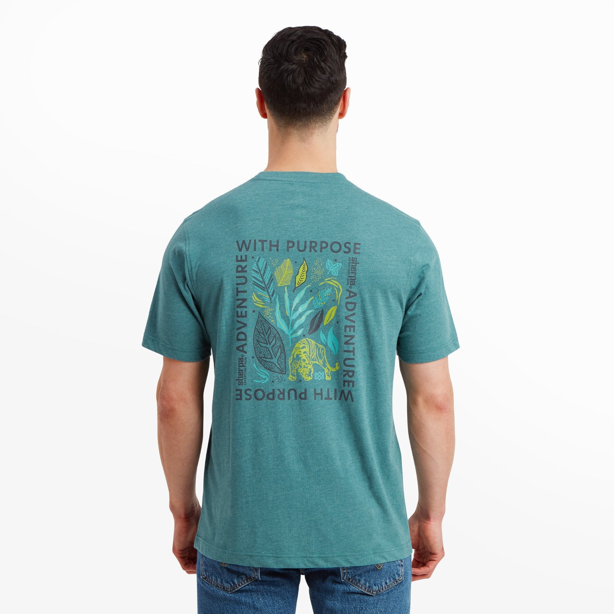 The back of the Sherpa Adventure Gear Purpose T-Shirt in Blue is shown, featuring a larger graphic design with the words “Adventure With Purpose” surrounding colorful illustrations of leaves, a butterfly, and a tiger. The vibrant design adds an adventurous and nature-inspired feel to the shirt.