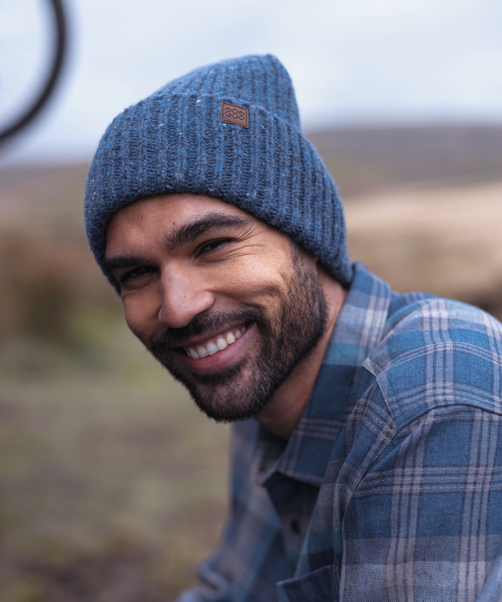Model wears a Sherpa Adventure Gear Panauti Hat in Blue