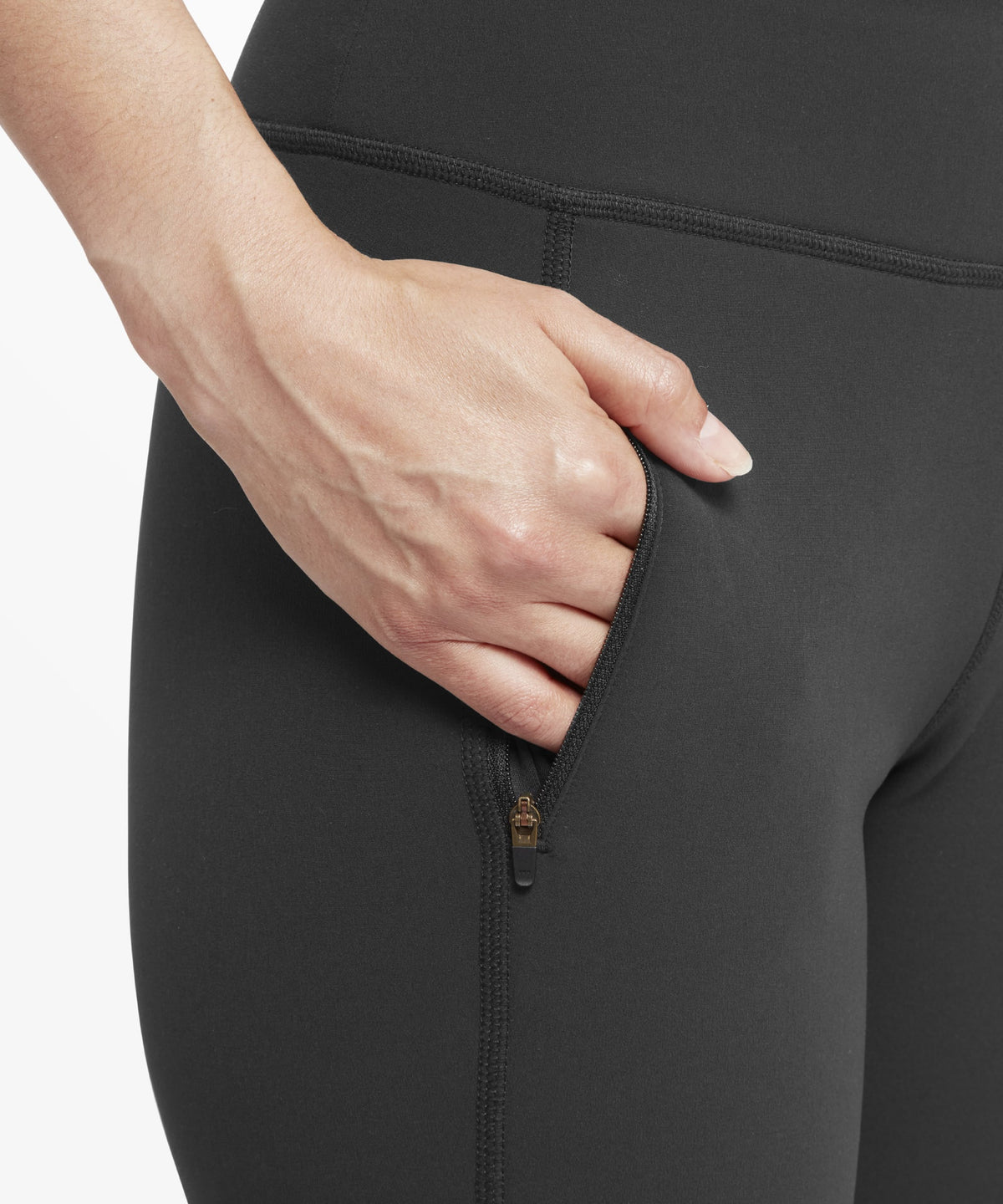 Dolma Softshell black leggings with gold zippered side pocket