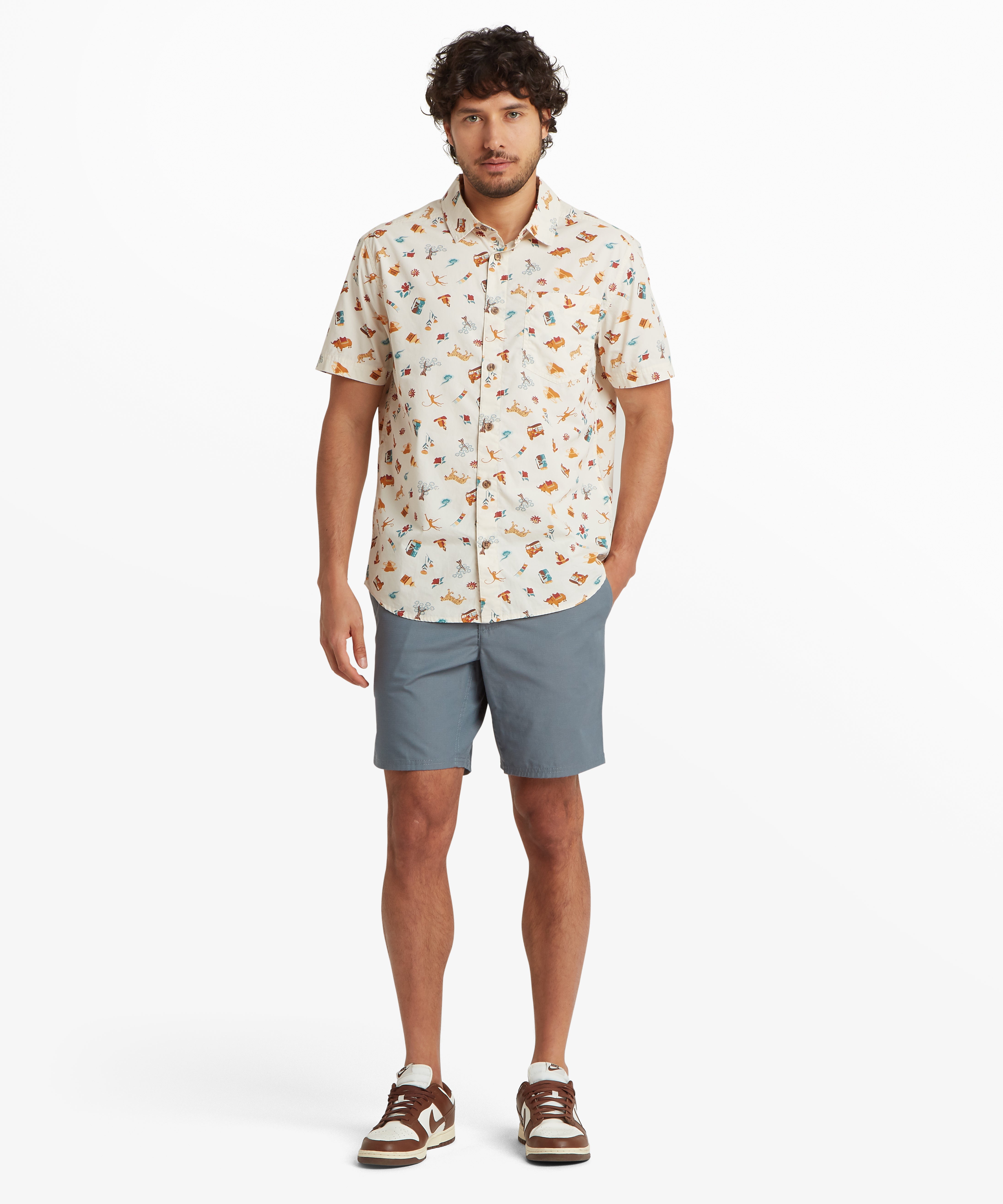 Man in Ghoral Shorts Stormy wearing cream food-pattern button-up shirt