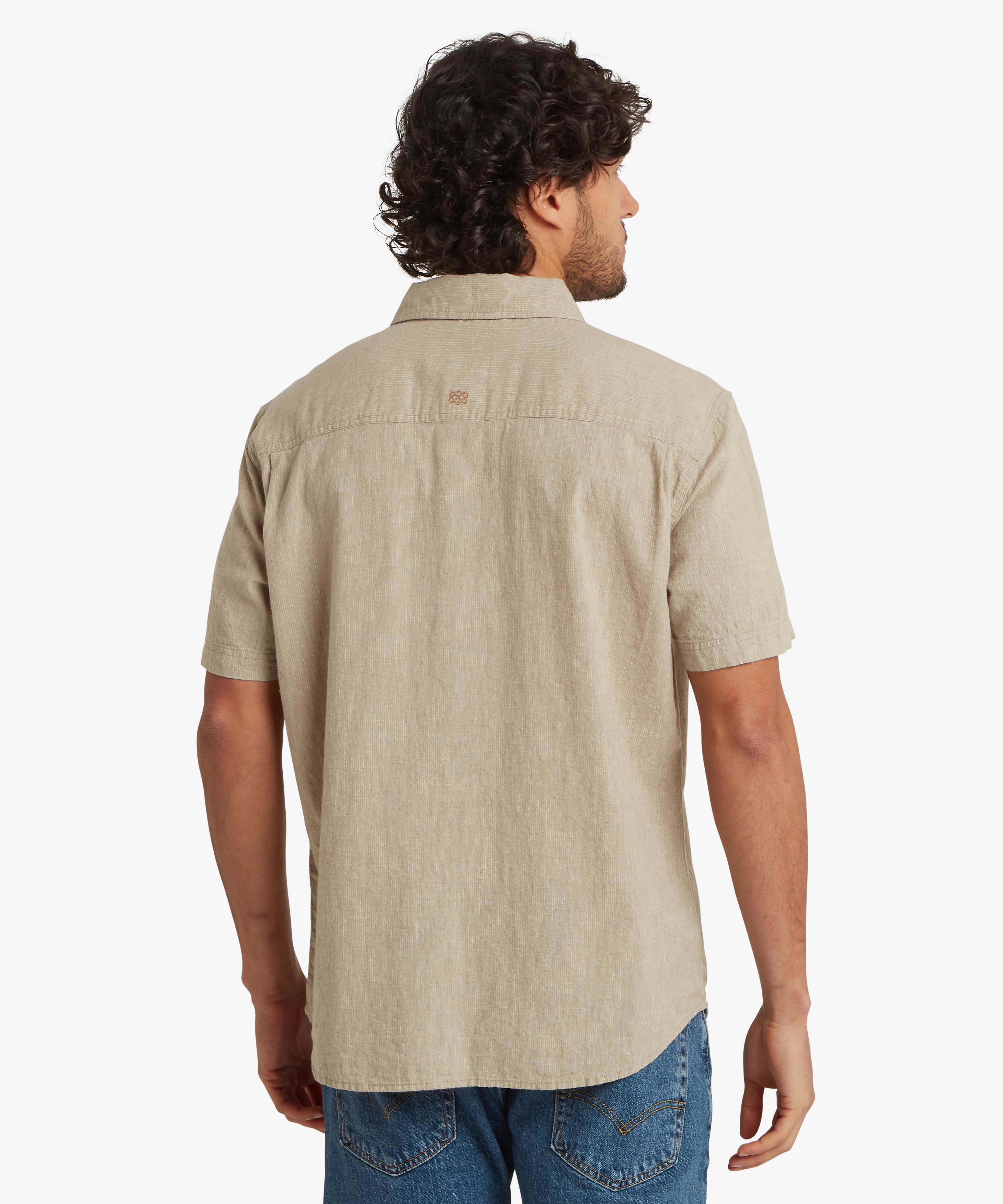 Back view of Habba Short Sleeve Shirt - Goa Sand, beige textured button-up with embroidered logo