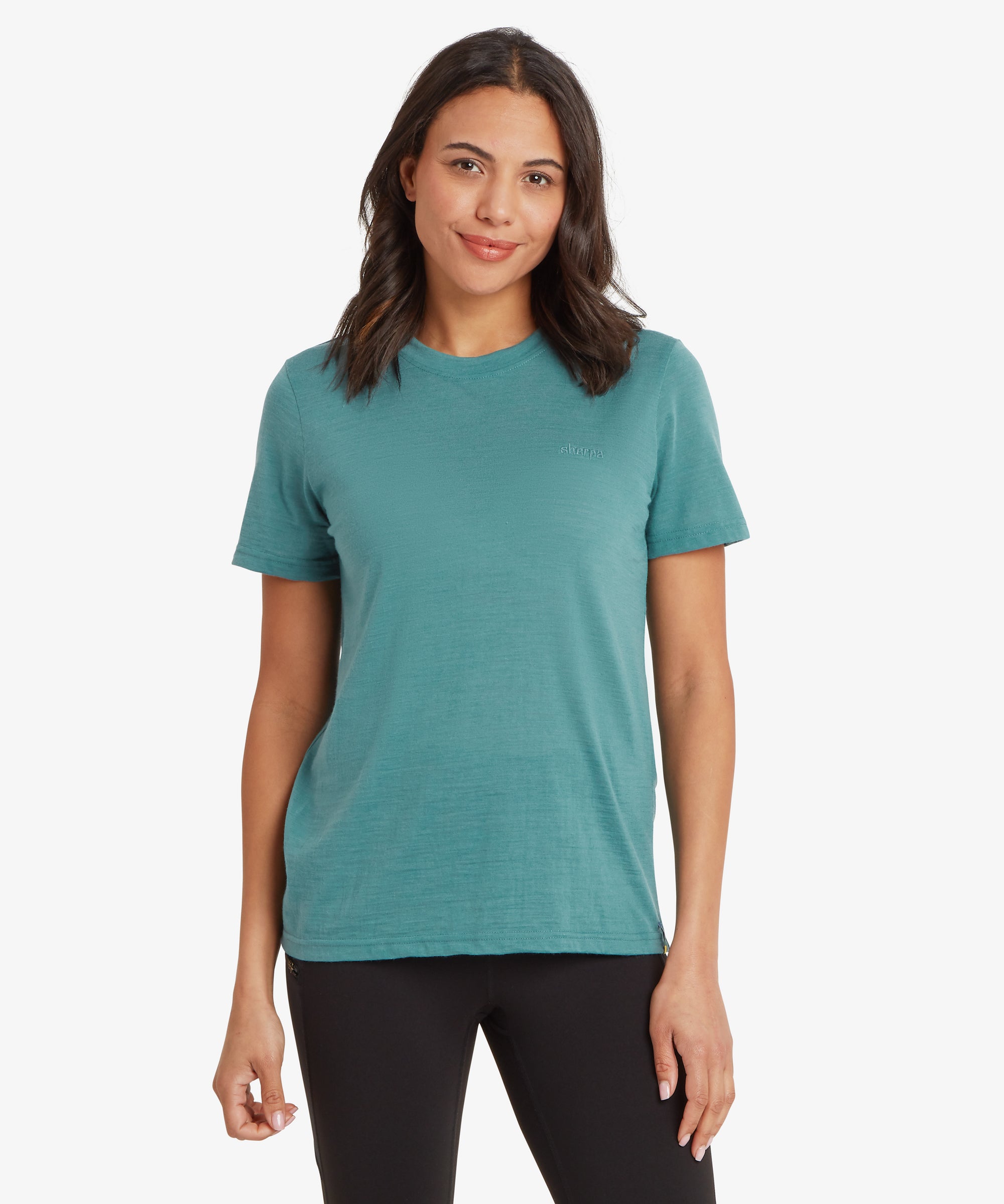 Woman wearing a teal t-shirt on a white background