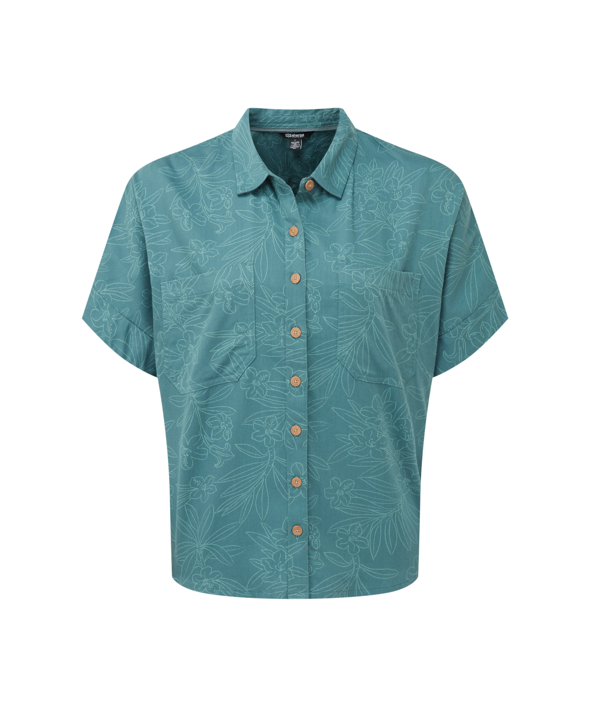 Women's teal patterned shirt with brown buttons and a floral outline pattern on a white background