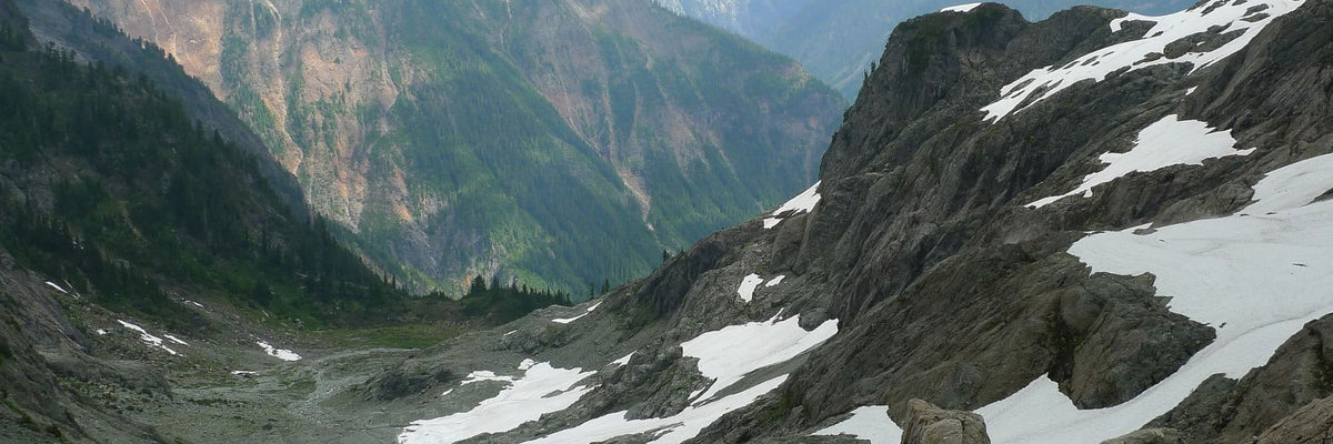 Rugged gray rock formations with snow in Cascade Range
