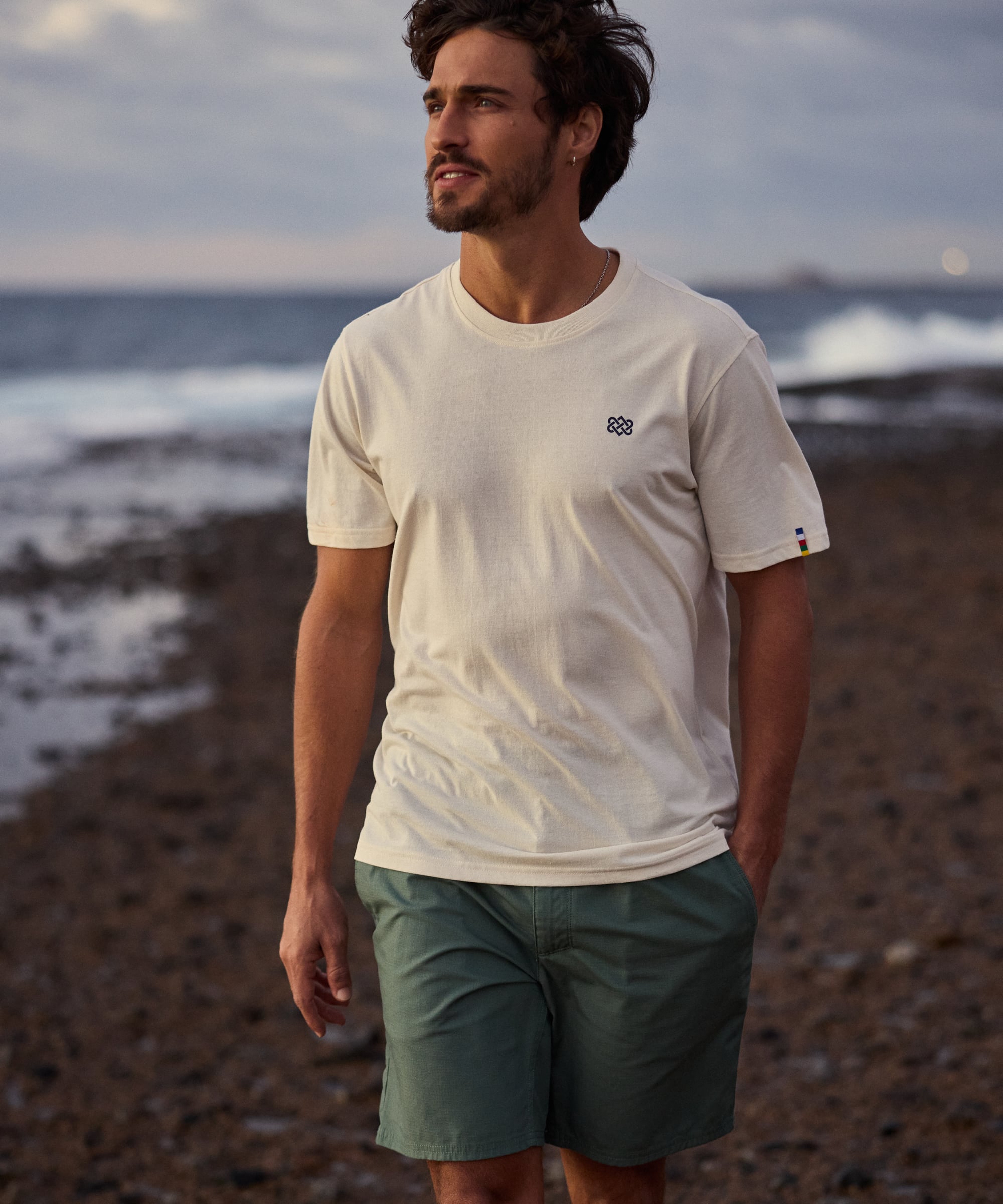 Jutnu Himalayan Peetho T-shirt: cream cotton with black chest logo
