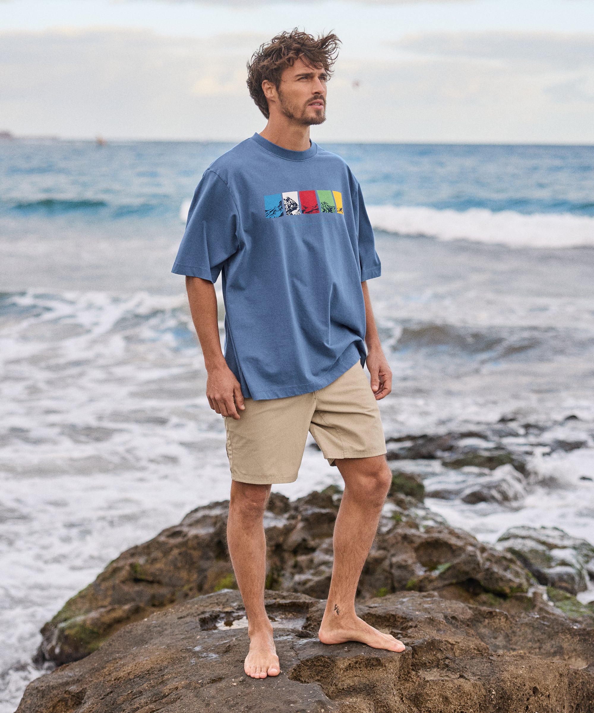 Tarcho Mountain T-Shirt in vintage blue with colorful chest graphic