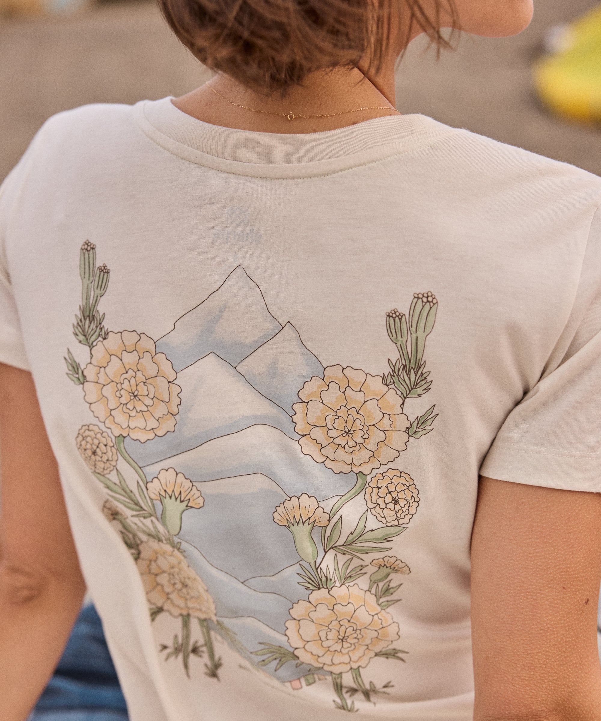 Bali Mountain T-Shirt - Peetho in cream cotton with mountain and marigold print