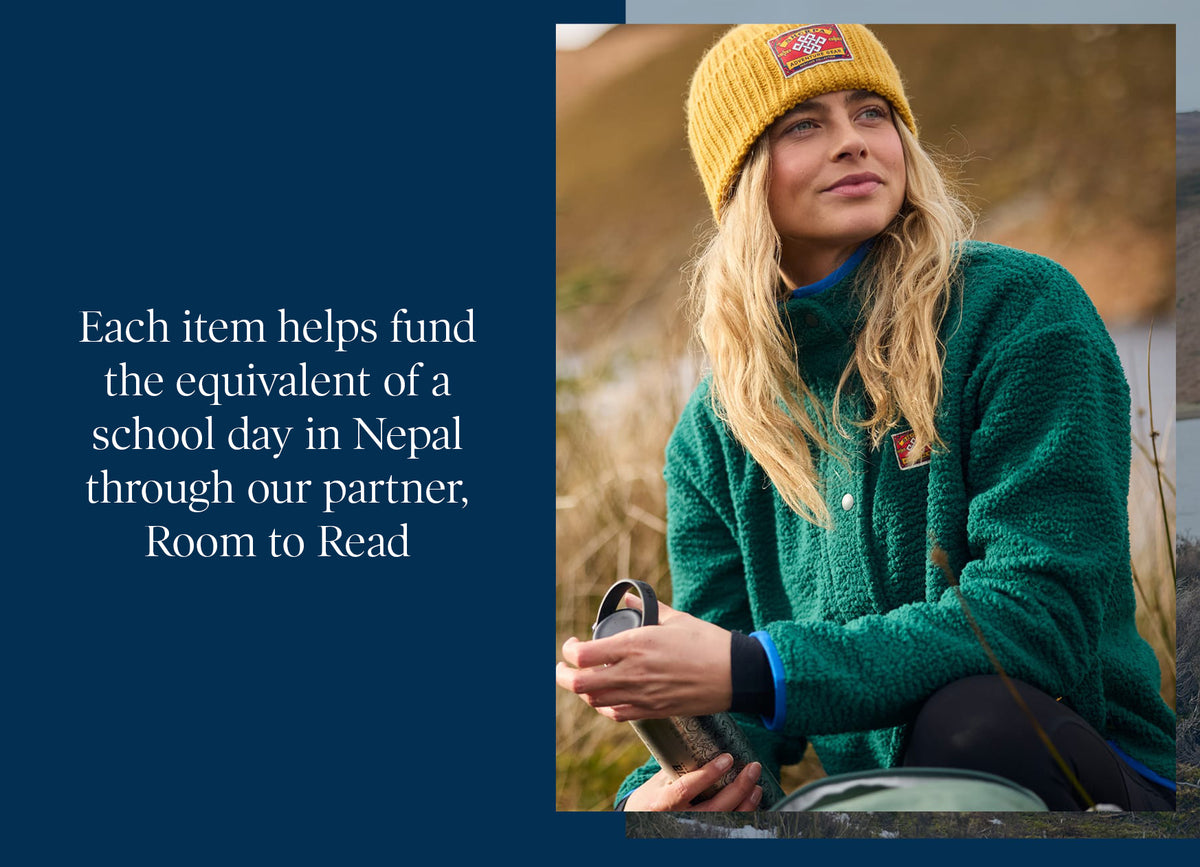 Woman in yellow beanie and green fleece holding a thermos, with Room to Read logo text panel.