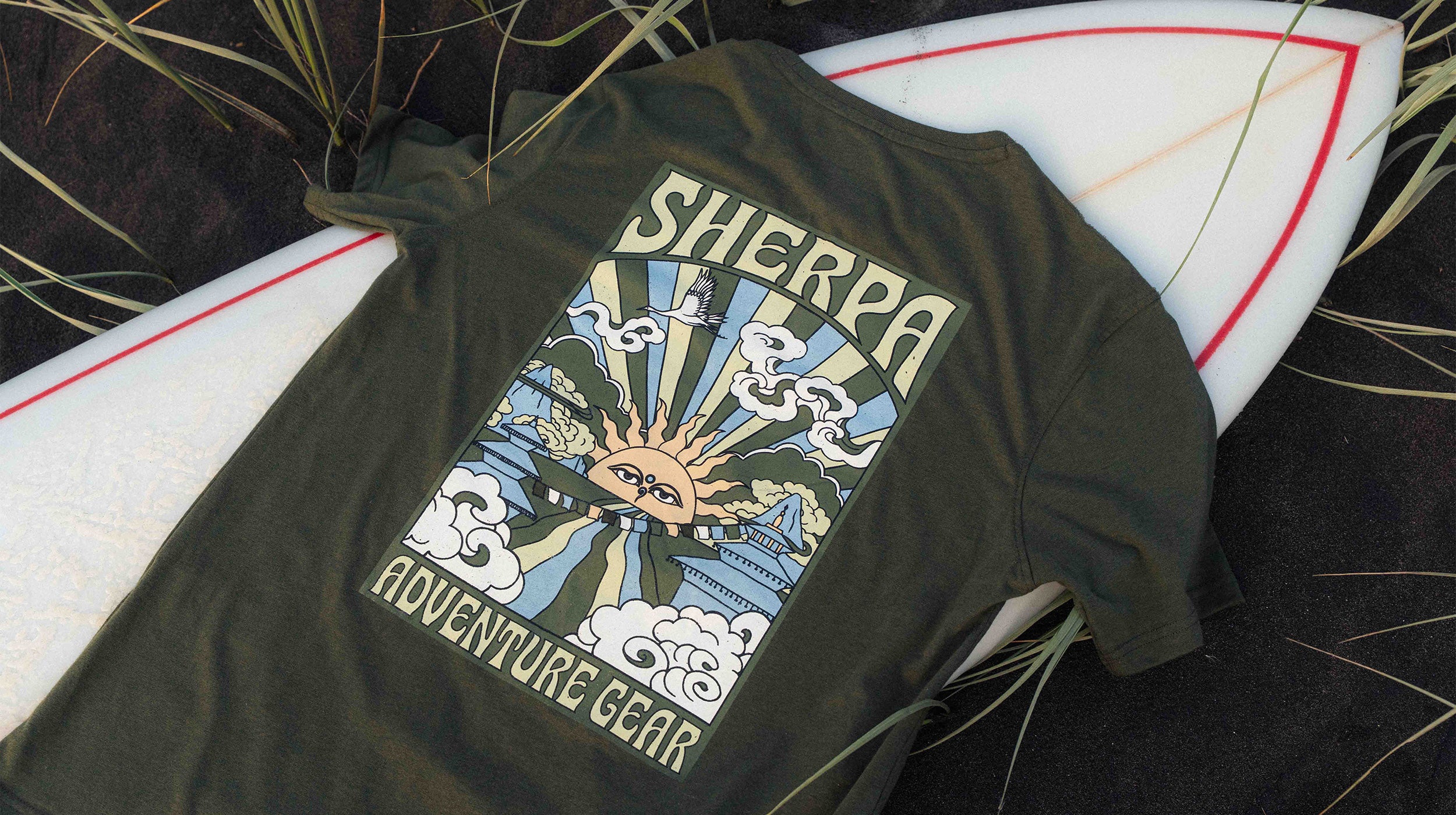 Green t-shirt with Sherpa Adventure Gear logo on a surfboard