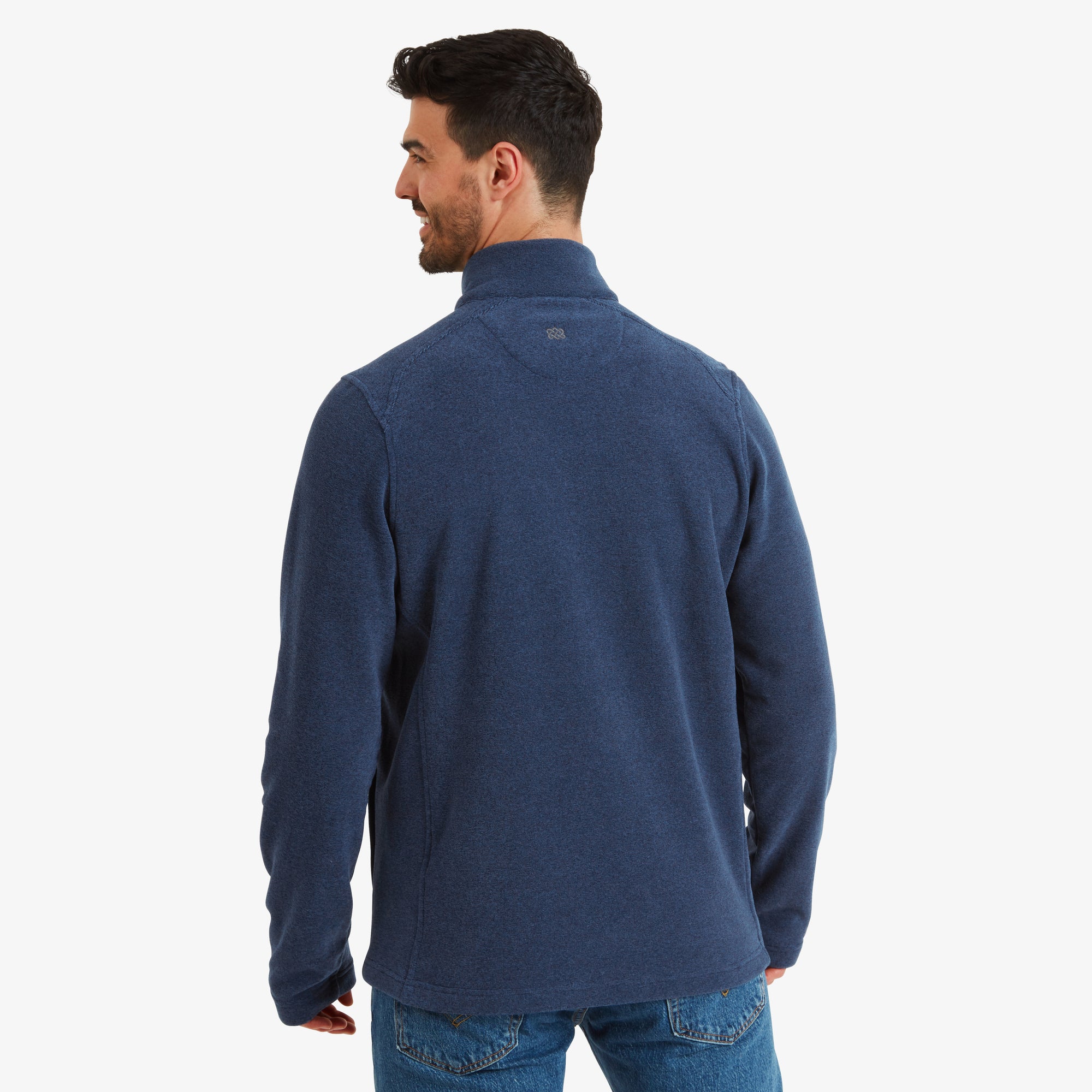 A rear view of the Sherpa Adventure Gear Rolpa Eco Jacket in Blue highlights the smooth and uninterrupted back design. A small Sherpa Adventure Gear logo detail is placed near the nape, adding a subtle branding touch. The sleeves and hem fall naturally, presenting the jacket’s comfort.