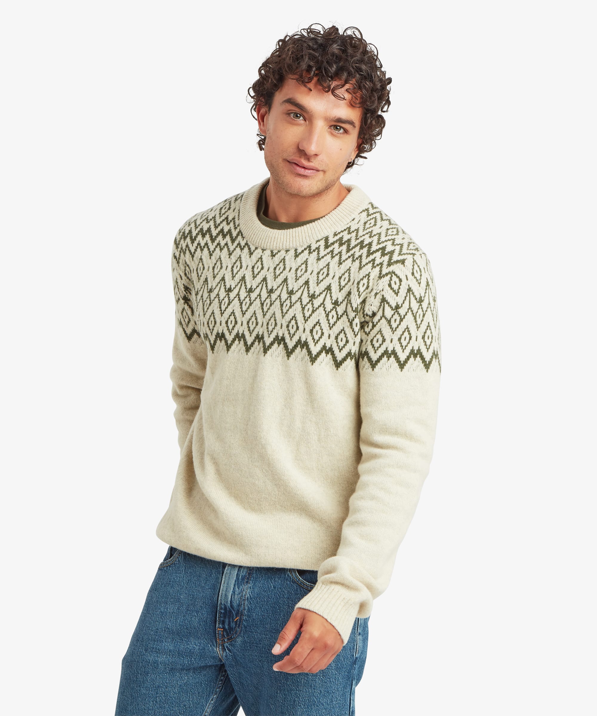 Front view of a men's crew-neck knit sweater in a soft cream colour. The sweater features a regular fit and an olive green geometric Fair Isle-inspired pattern across the chest, shoulders and upper sleeves.