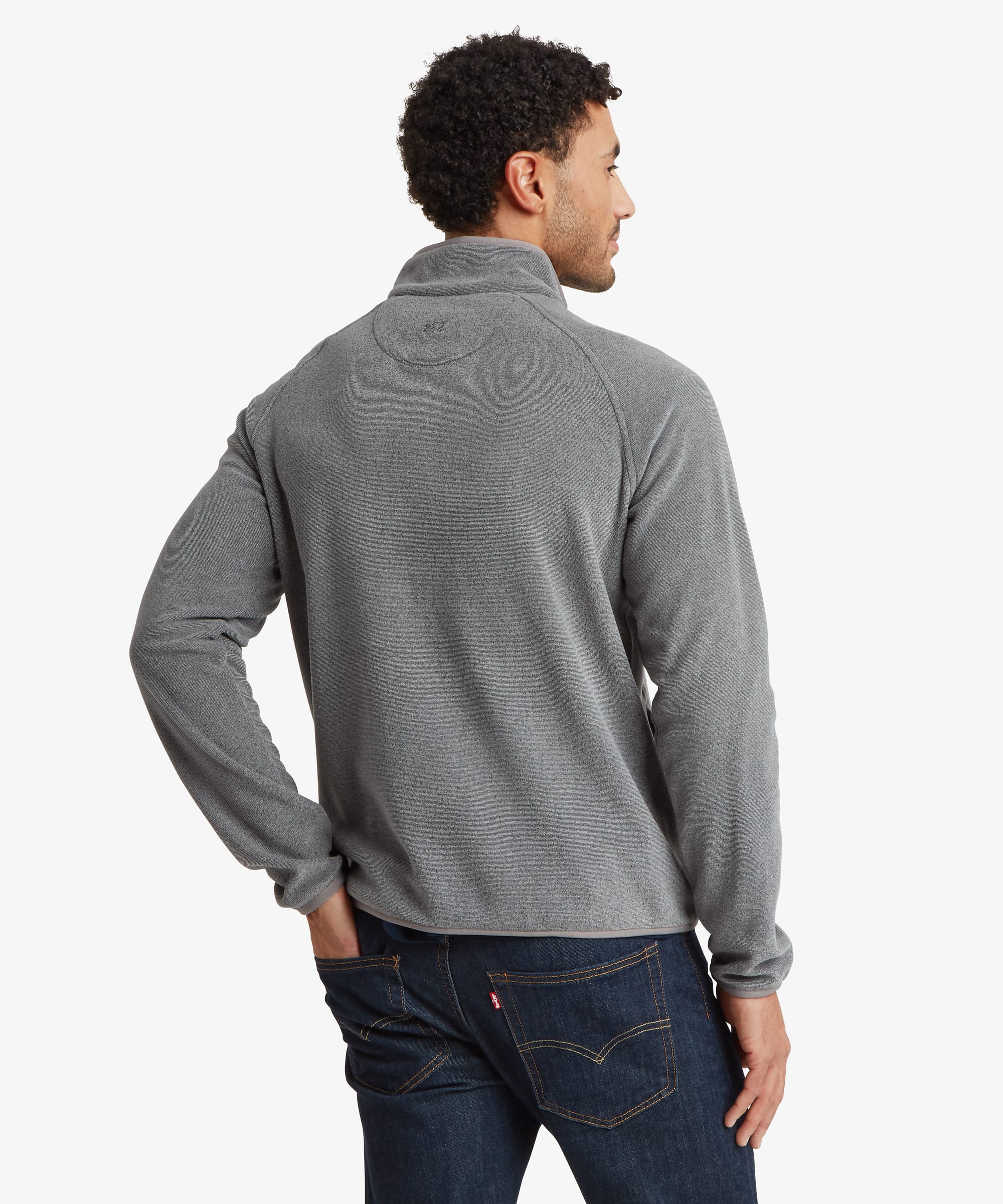 Back view of the grey Rolpa fleece pullover, showing the clean rear panel, stand collar, and relaxed fit through the shoulders and body.