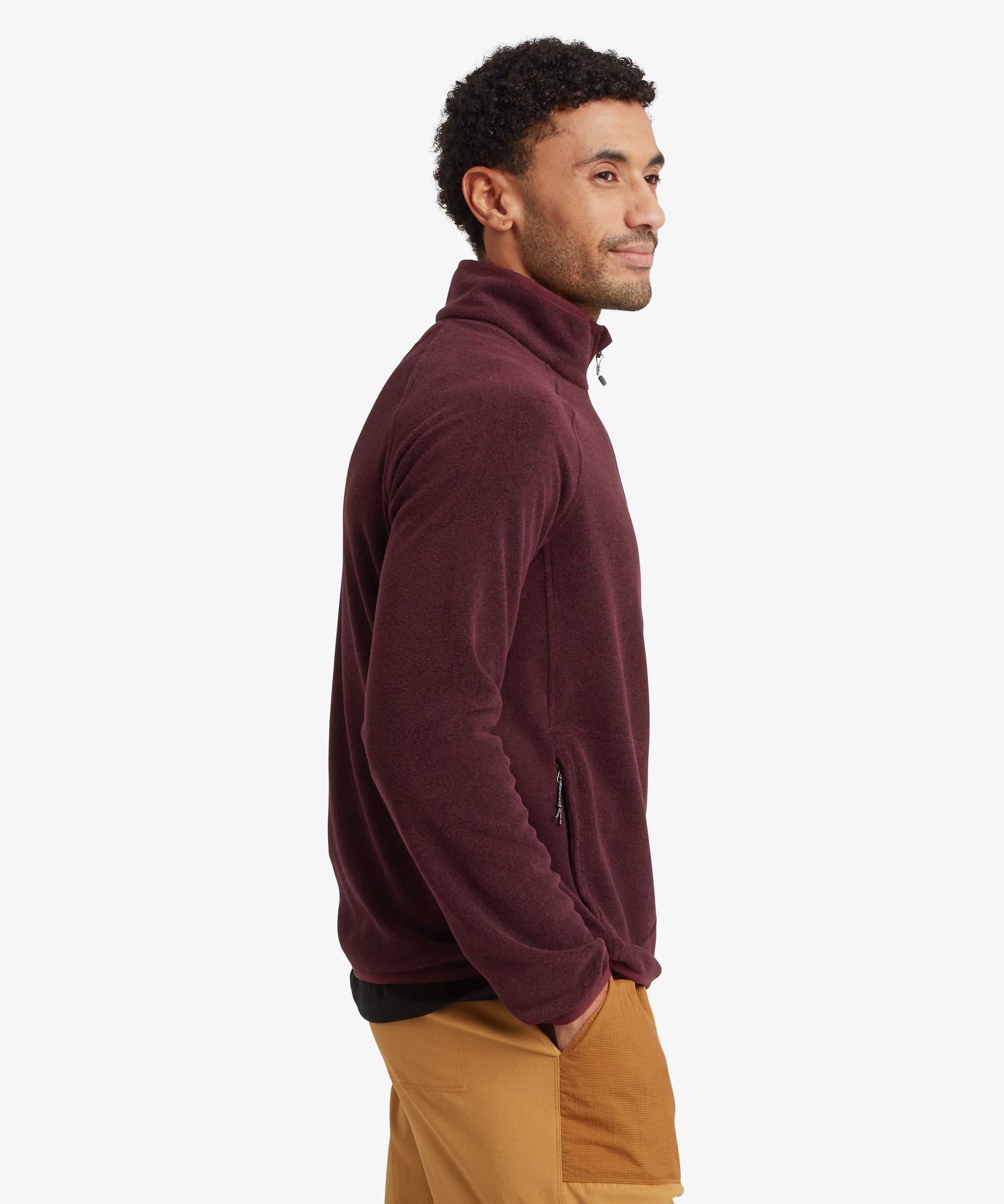 Side profile of a man wearing a burgundy quarter-zip fleece pullover. The regular-fit design features a high collar, chest pocket and clean silhouette through the body and sleeves.