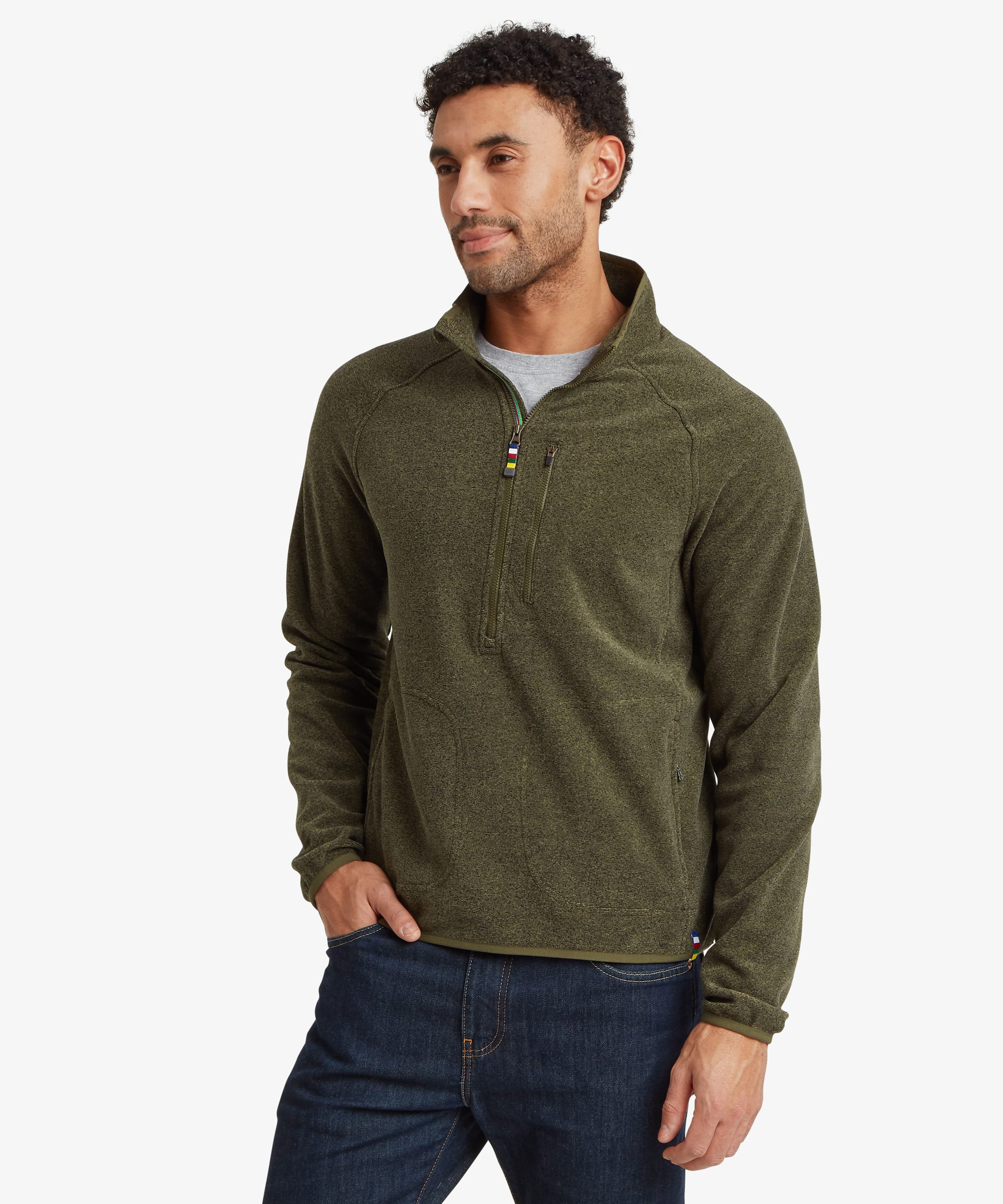 Man wearing an olive green heathered quarter-zip fleece pullover with a stand collar, zippered chest pocket and raglan sleeves. Styled with blue jeans, the fleece has a regular fit for everyday comfort.
