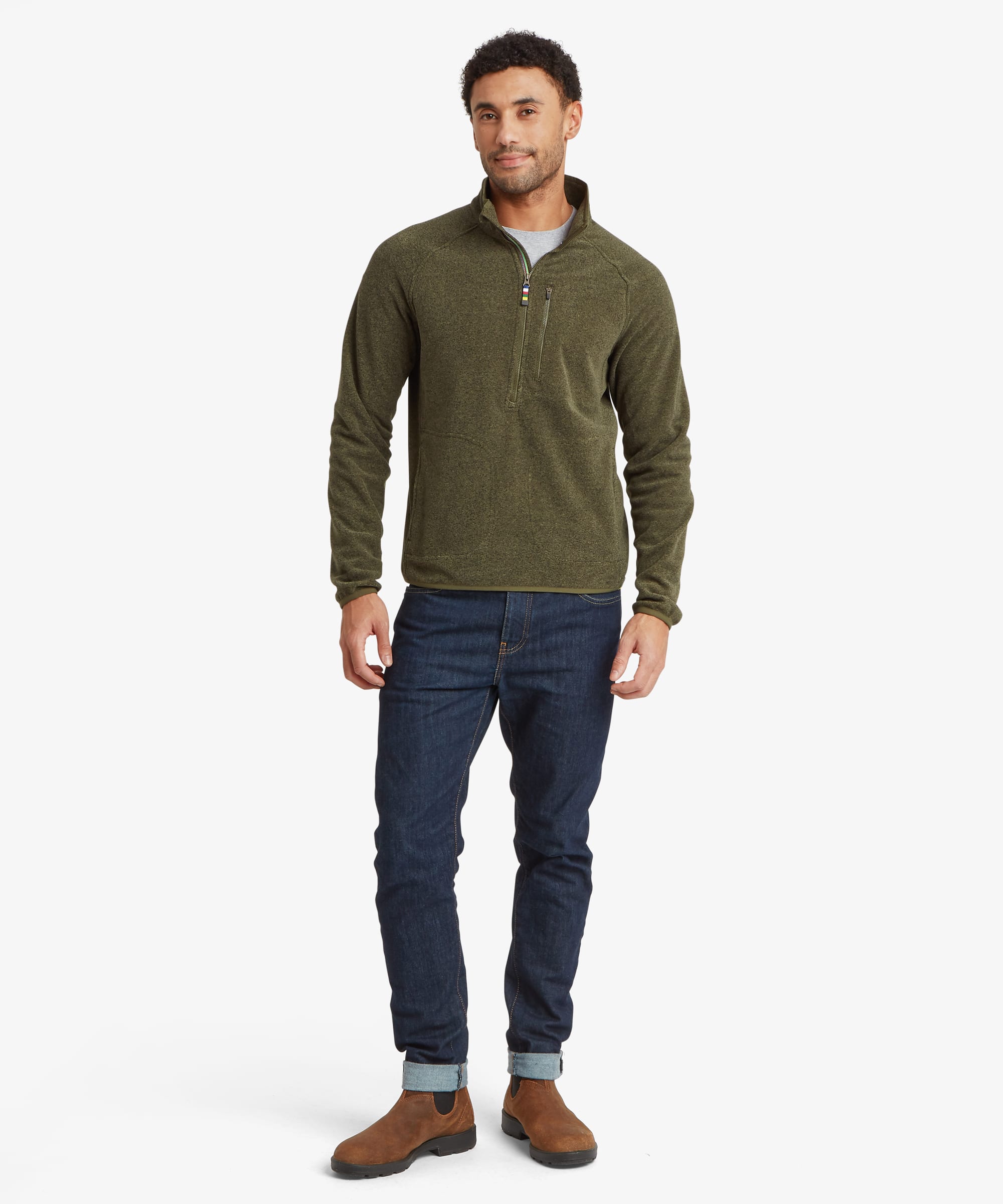 Full-length front view of an olive green quarter-zip fleece paired with blue jeans. The regular-fit design features a stand collar, chest pocket and clean outdoor-inspired styling.