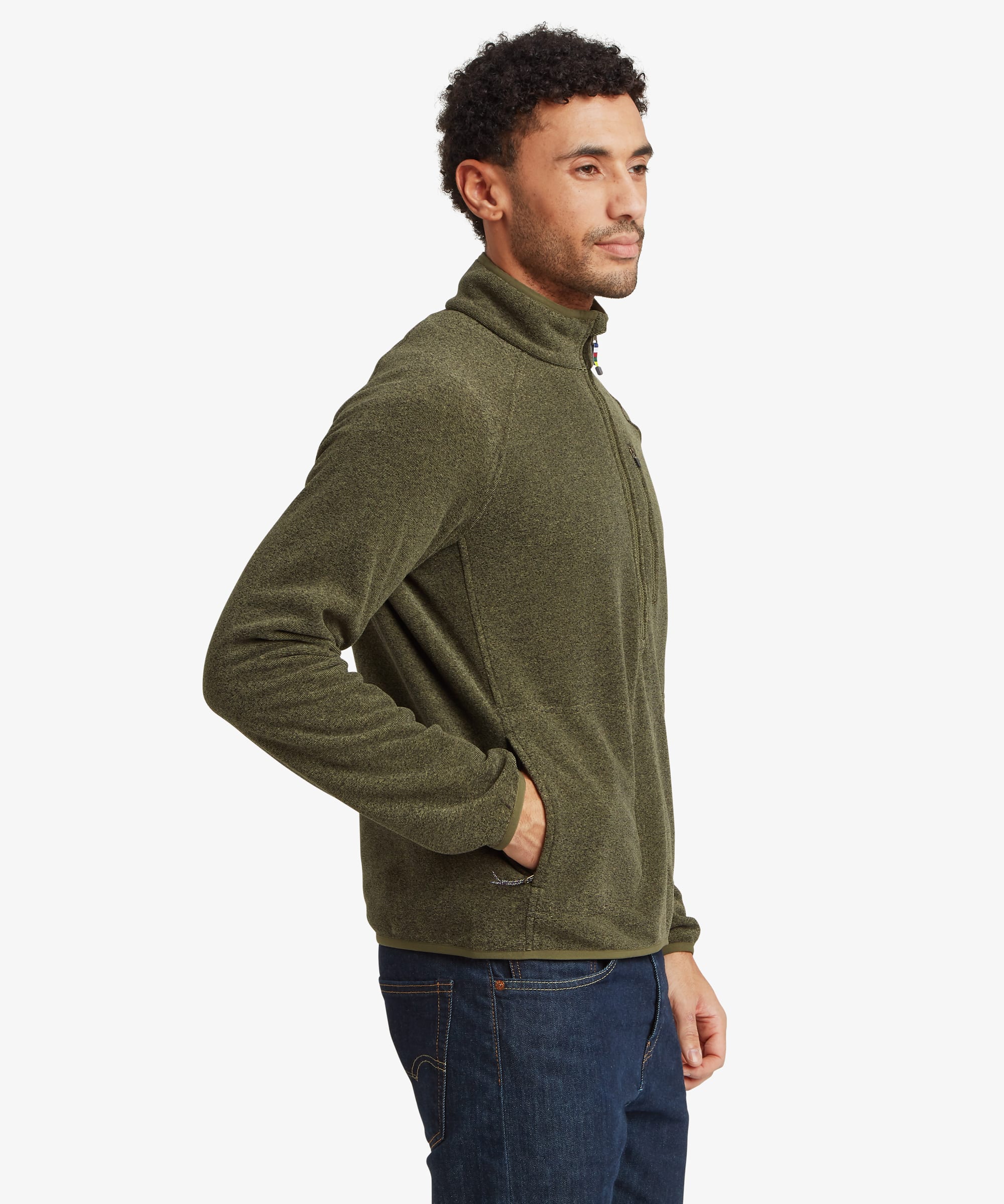Side profile of a man wearing an olive green quarter-zip fleece with a high stand collar and zip chest pocket. The regular fit provides room for layering while maintaining a streamlined silhouette.