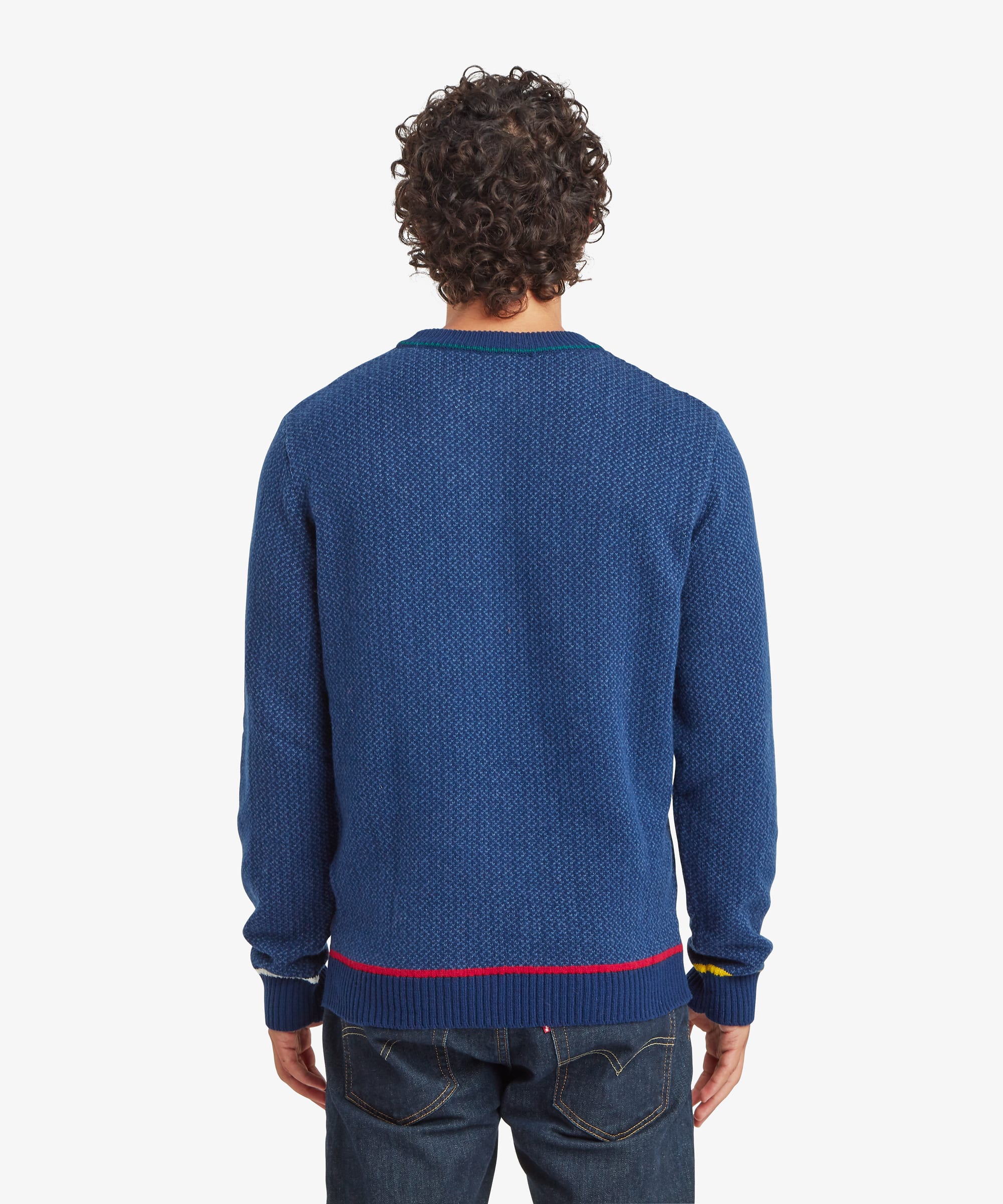 Back view of a blue crew neck sweater showing the textured knit pattern extending across the rear panel and sleeves.