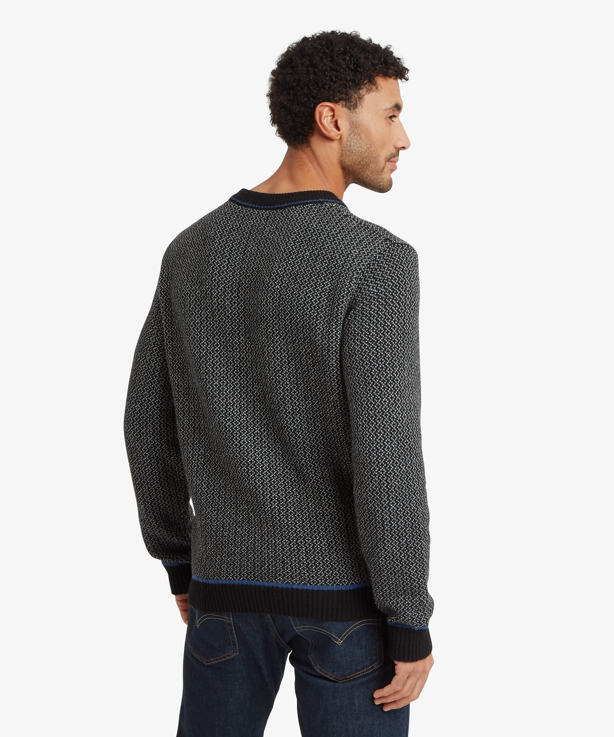 Rear view of a charcoal grey textured crew neck sweater displaying the continuous knit pattern across the back and ribbed hem finish.