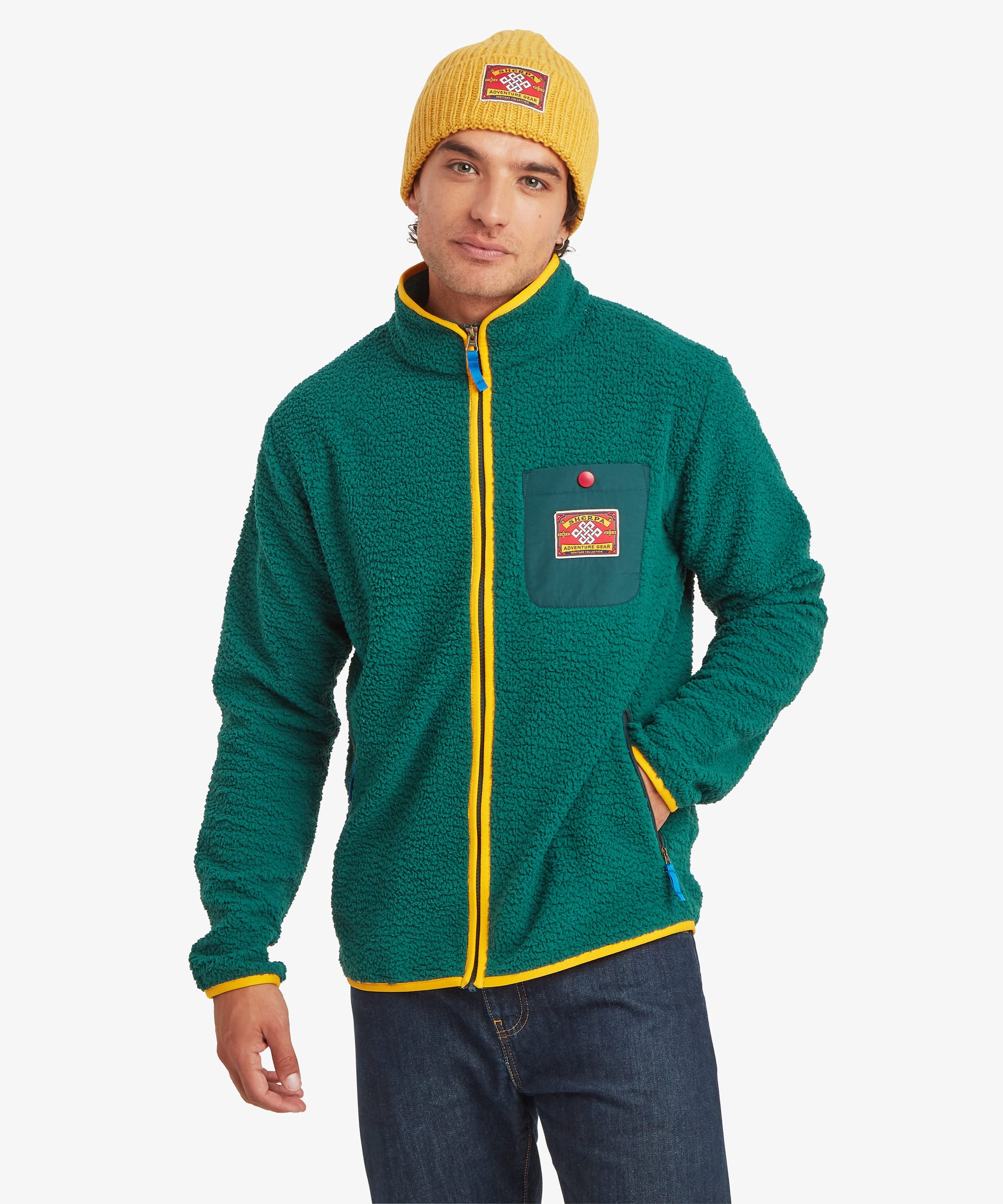 Front view of a green sherpa fleece full-zip jacket featuring bright yellow contrast zippers, a contrast chest pocket with logo patch, and a high stand collar.