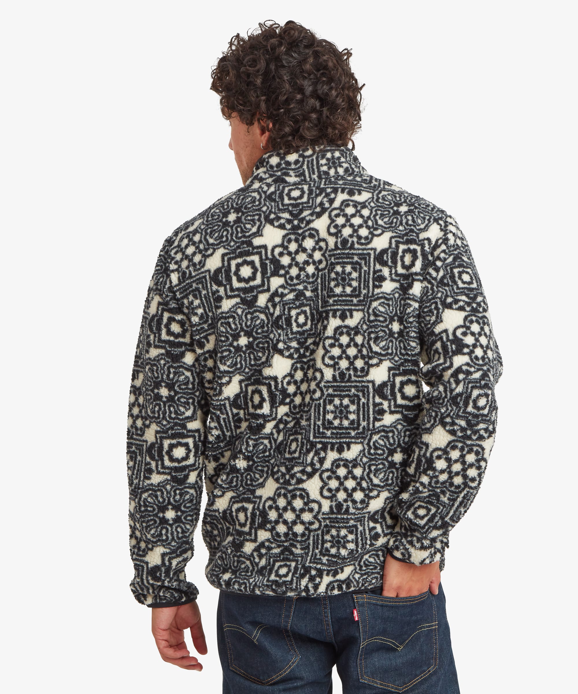 Back view of a black printed full-zip fleece jacket featuring an allover geometric pattern. Designed with long sleeves and a stand collar.
