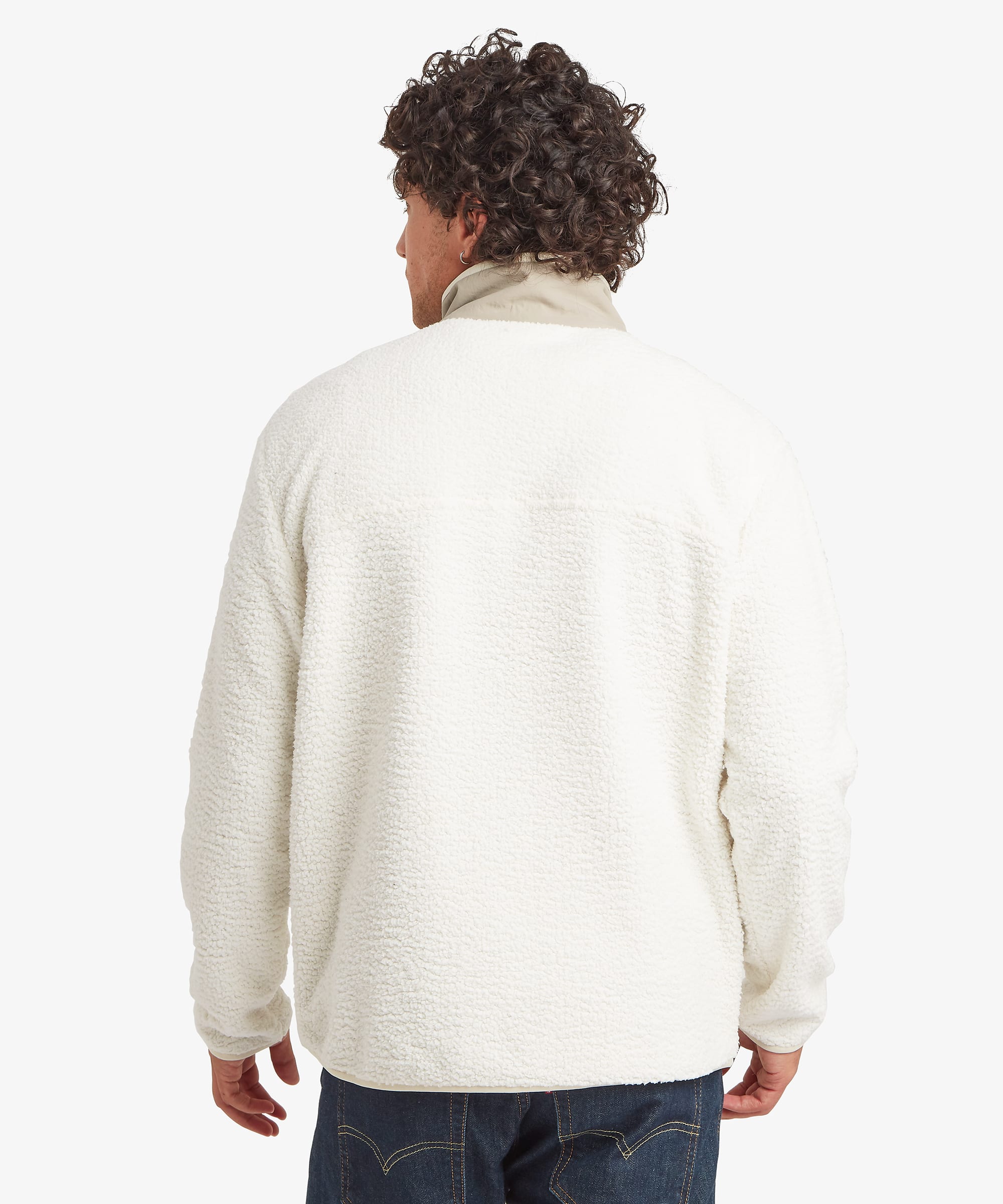 Rear view of a male model wearing the Sherpa Tarcho Snap Pullover in white, displaying the clean back design, stand collar, relaxed fit and long sleeves.