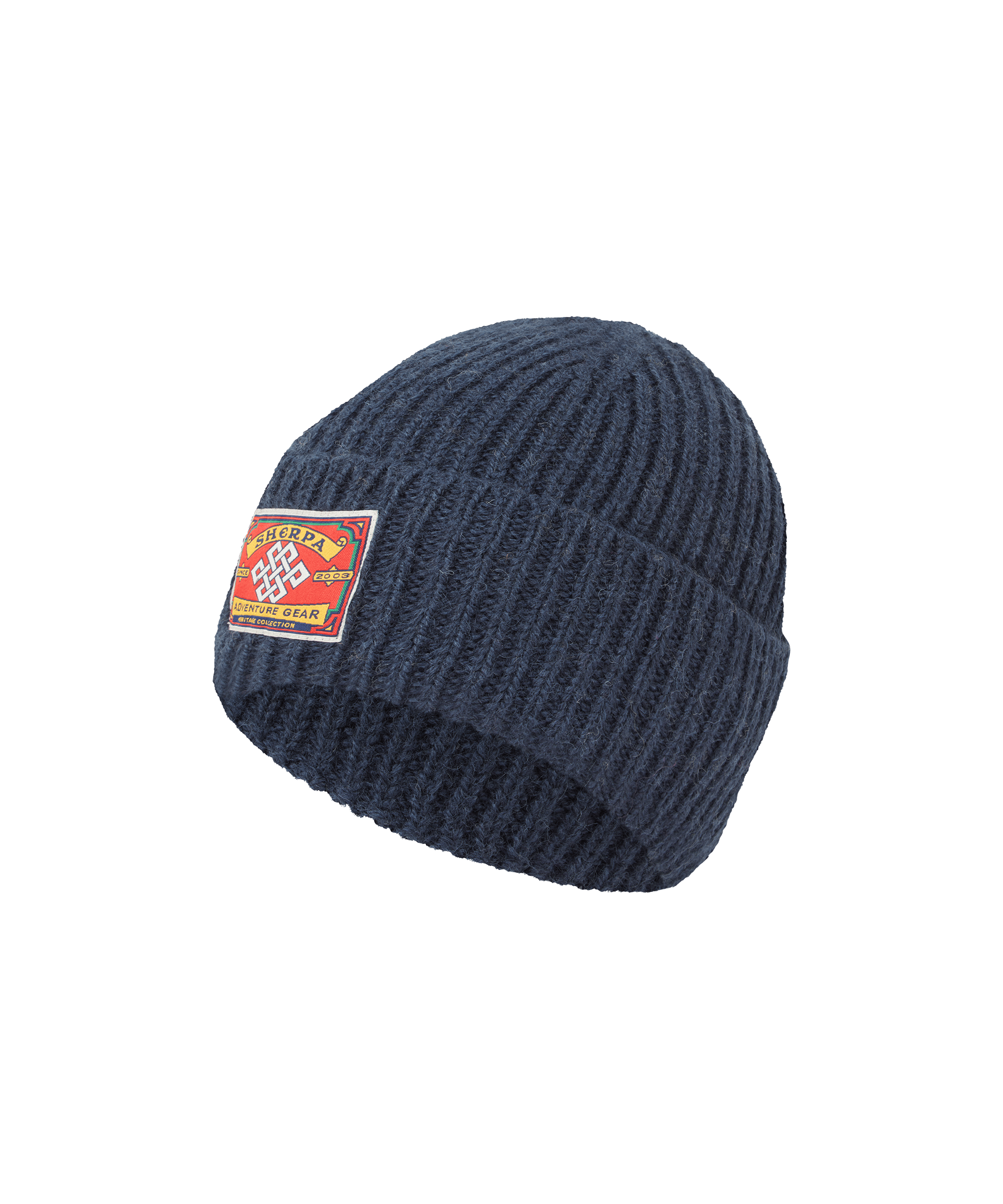 Front view of a Sherpa Adventure Gear unisex rib-knit beanie in navy blue. Features a folded cuff, chunky knit construction, signature logo patch, and versatile everyday warmth.