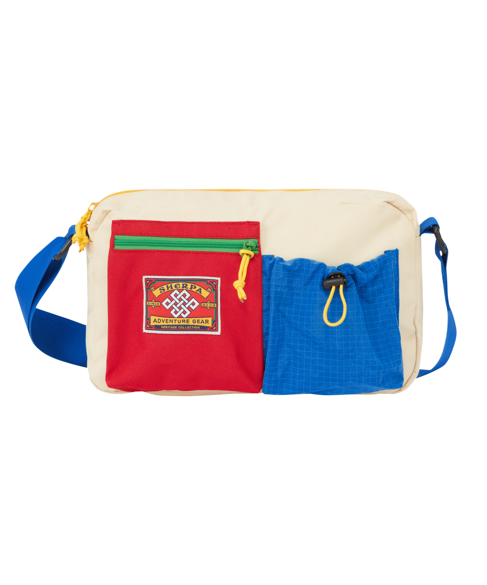 Multicolored side bag with a red, zipped pocket featuring a red, heritage mountaineering patch on the front. Next to the yellow pocket is a blue elasticated pocket.