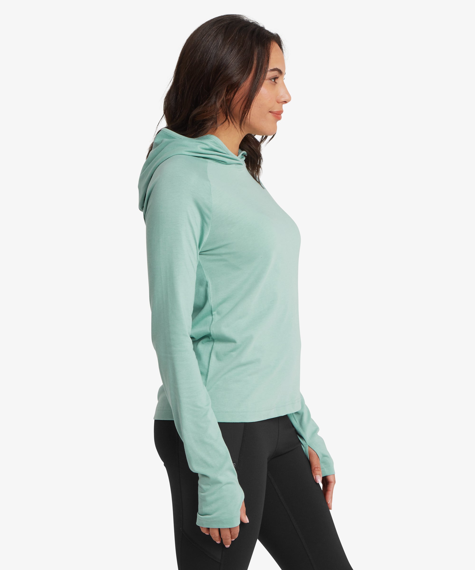 Side view of a light aqua long‑sleeve performance hoodie featuring a streamlined fit, lightweight knit construction, and extended sleeves designed for layering during outdoor activities.
