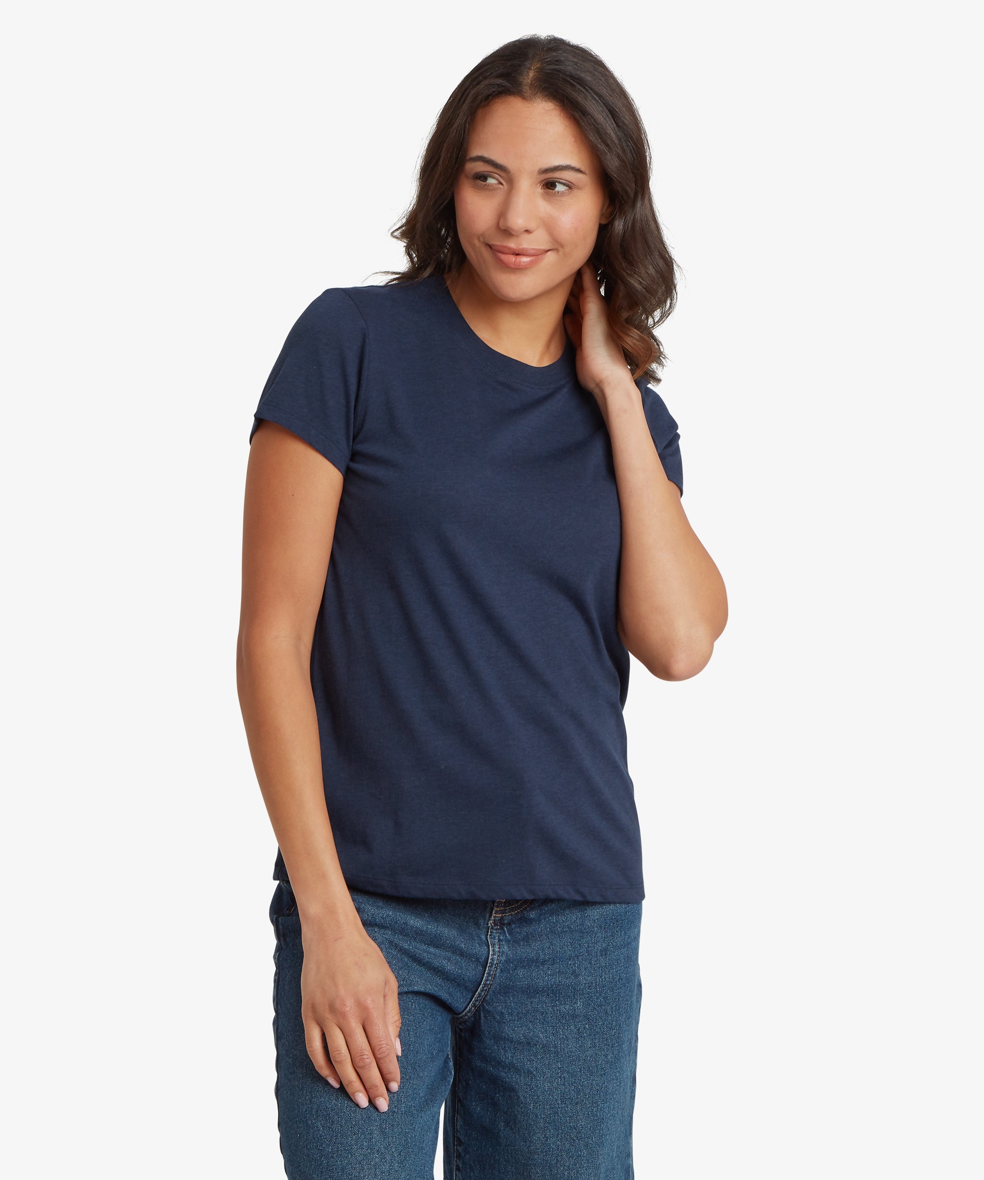 Front three‑quarter view of a navy blue women’s short‑sleeve crew‑neck T‑shirt paired with mid‑wash denim jeans. The T‑shirt features a smooth lightweight fabric, a relaxed everyday fit, and a hip‑length hem. The person’s stance shows the natural drape across the torso and sleeves, highlighting the clean, minimal design ideal for casual wear.