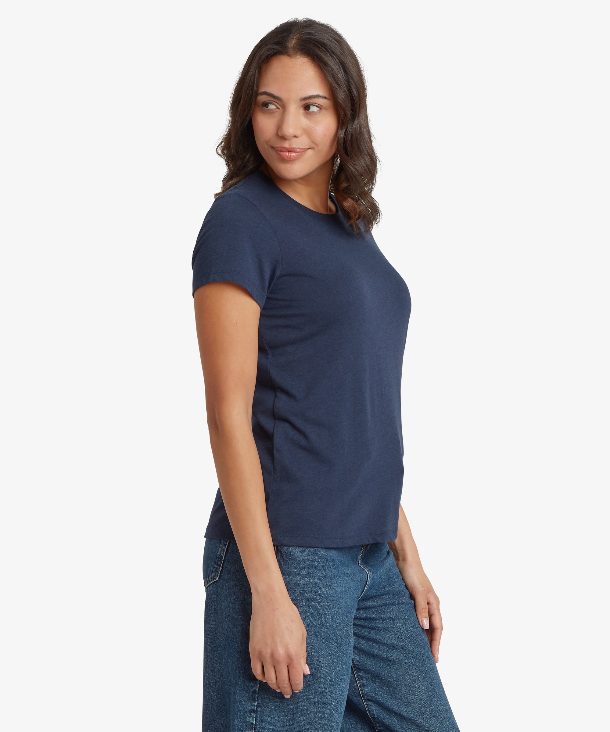 Side view of a navy blue women’s short‑sleeve T‑shirt paired with mid‑wash denim jeans. The T‑shirt features a classic crew neckline, smooth lightweight fabric, and a relaxed, hip‑length fit. The image highlights the natural drape of the material, the clean side seam, and the comfortable everyday silhouette, ideal for casual wear.