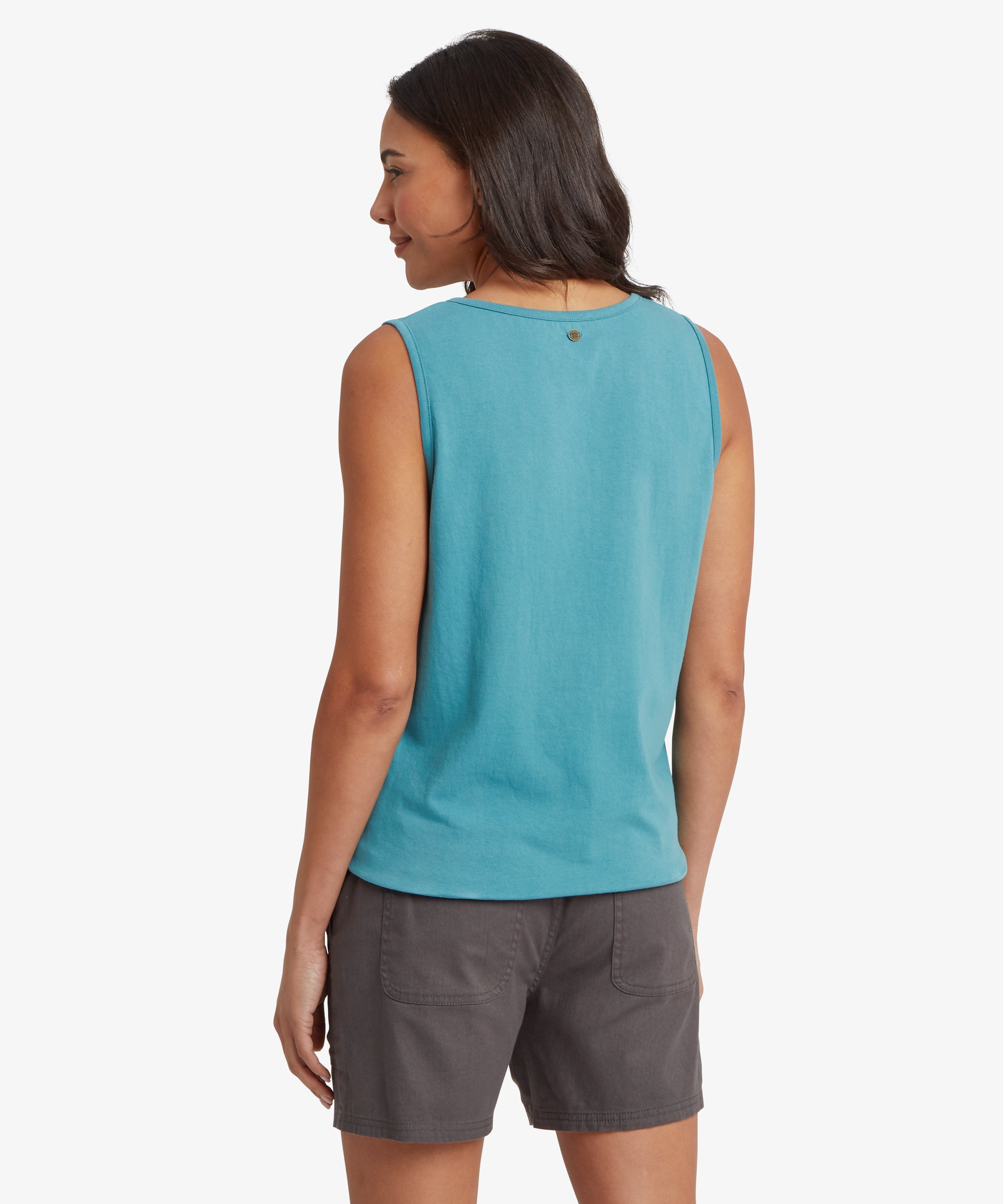 Back view of a turquoise sleeveless top paired with charcoal grey mid‑thigh shorts. The top has a smooth knit texture with a clean back panel and a small stitched detail near the neckline. The shorts feature two large rear patch pockets, reinforced seams, and a relaxed, comfortable fit. One arm hangs naturally by the side, highlighting a casual warm‑weather outfit suitable for travel, walking, and everyday outdoor wear.