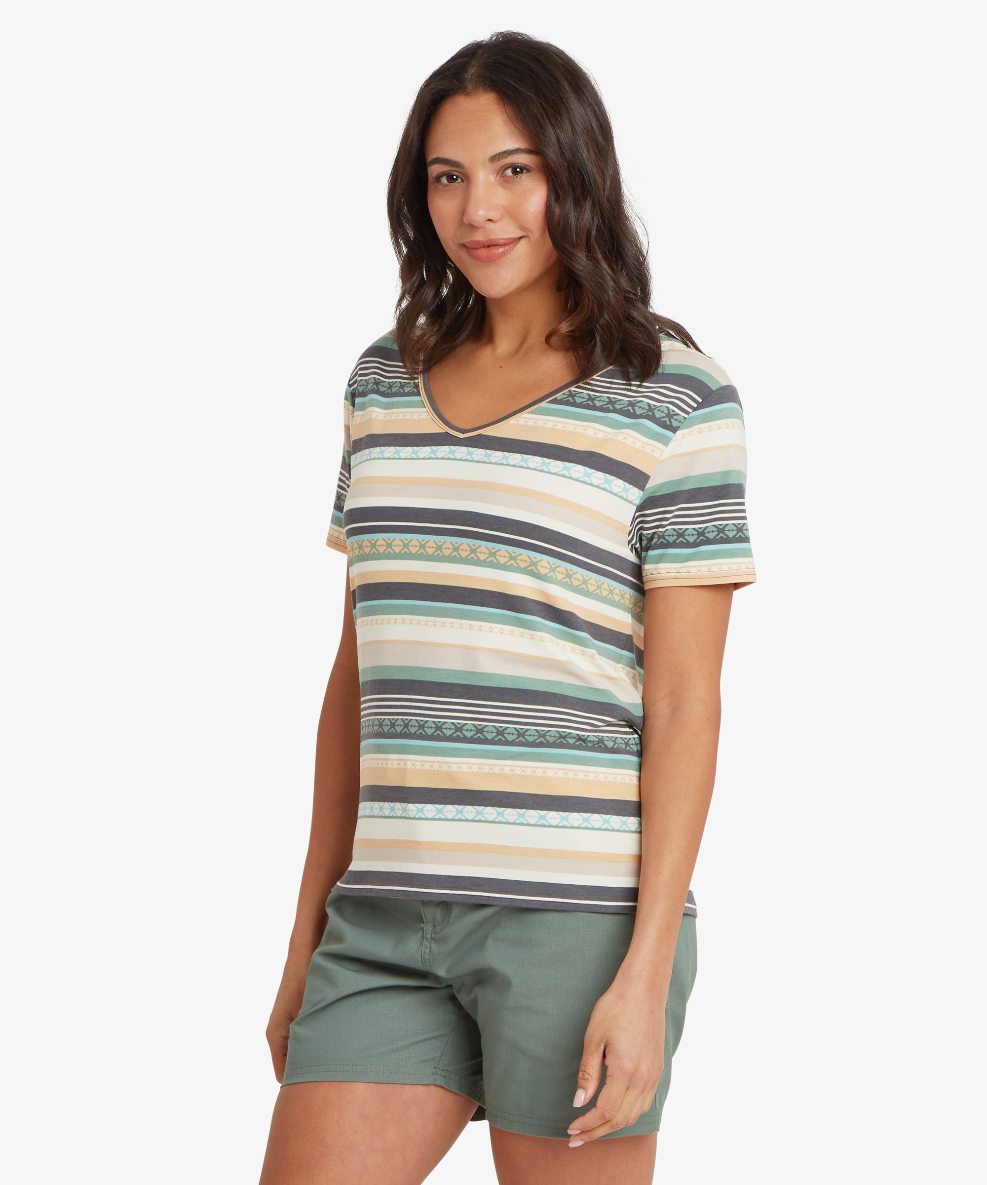 Woman facing forward wearing a striped V-neck T-shirt with a relaxed, lightly draped fit, paired with olive green shorts; her arms hang naturally by her sides and she has a soft, neutral smile.