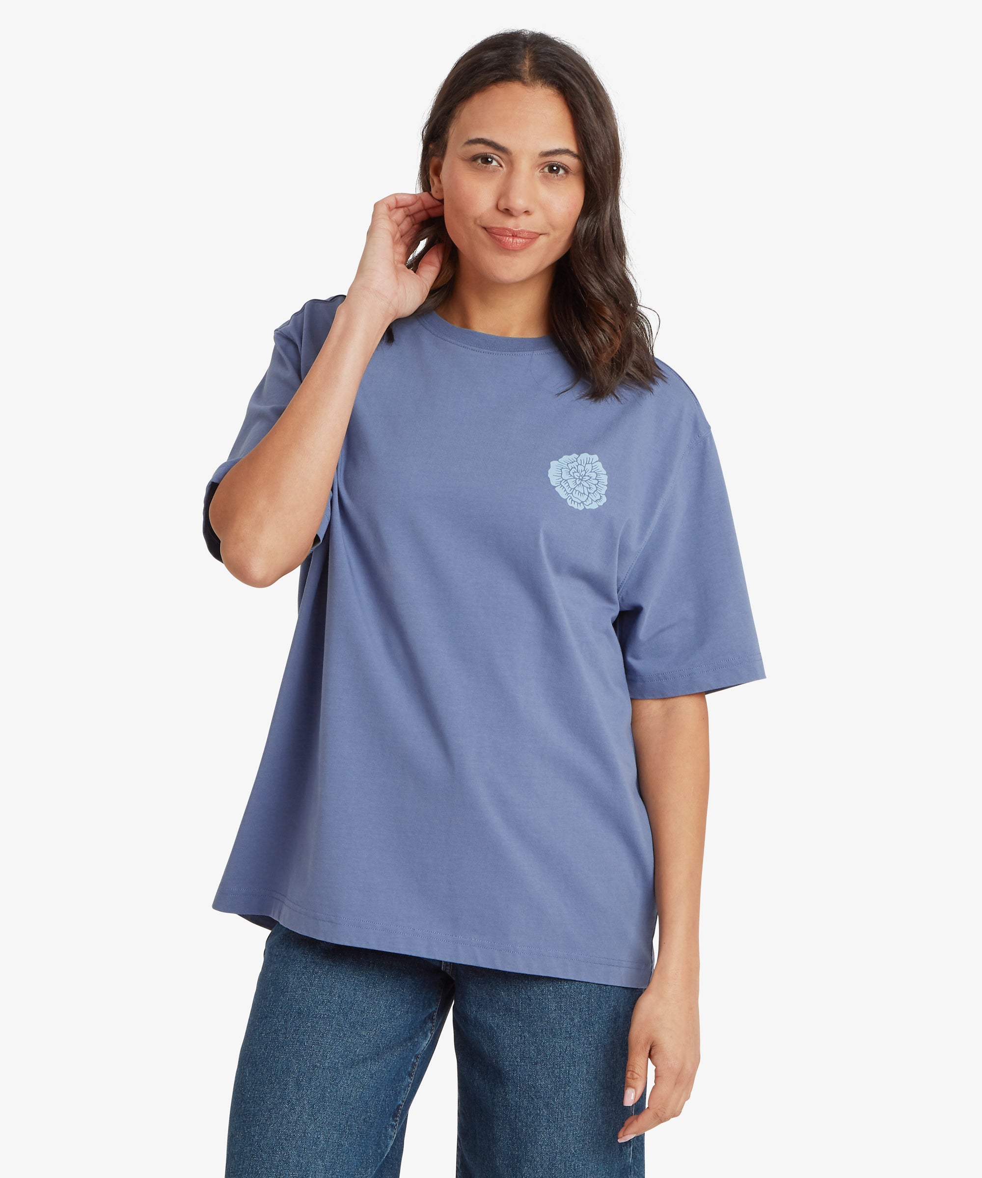Woman wearing a blue t-shirt with a logo on a white background