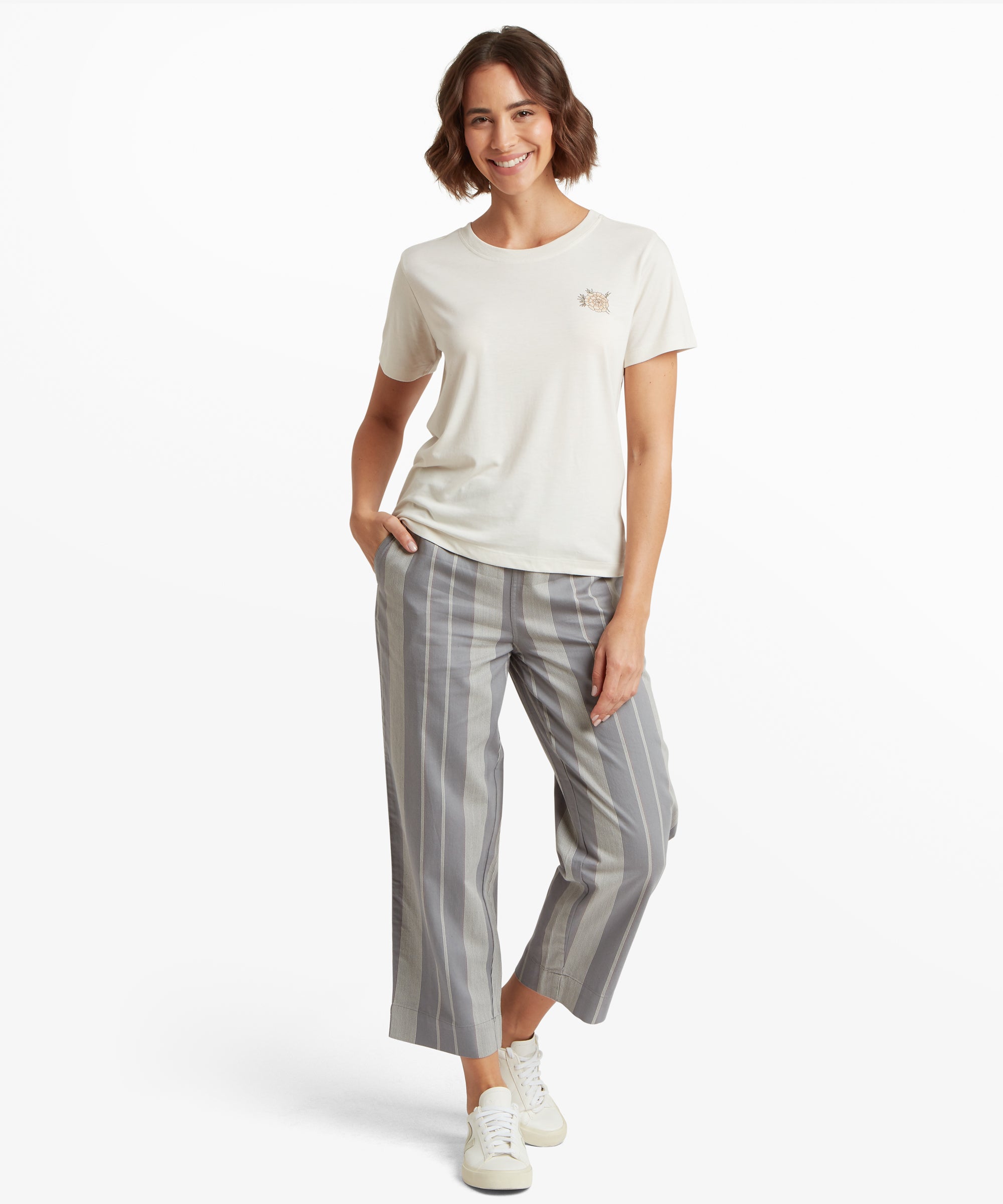 Woman wearing Bali Mountain T-Shirt - Peetho cream t-shirt with embroidered logo