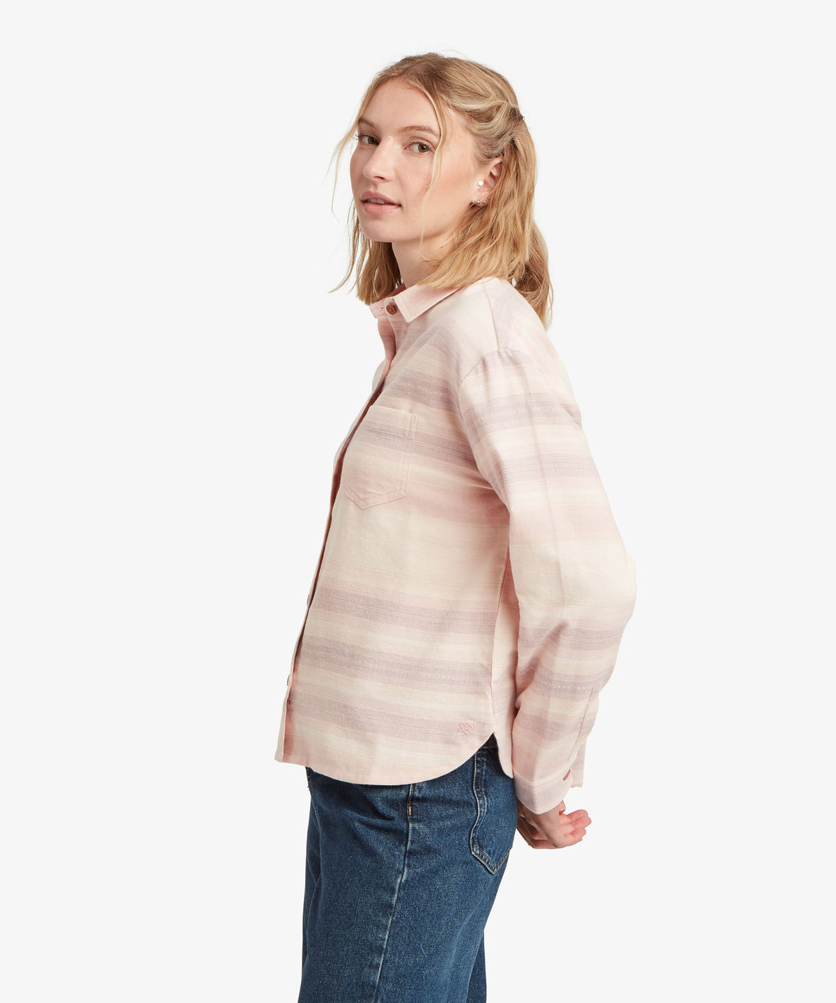 Woman wearing Sherpa Adventure Gear Beeja Long Sleeve Shirt in beige.