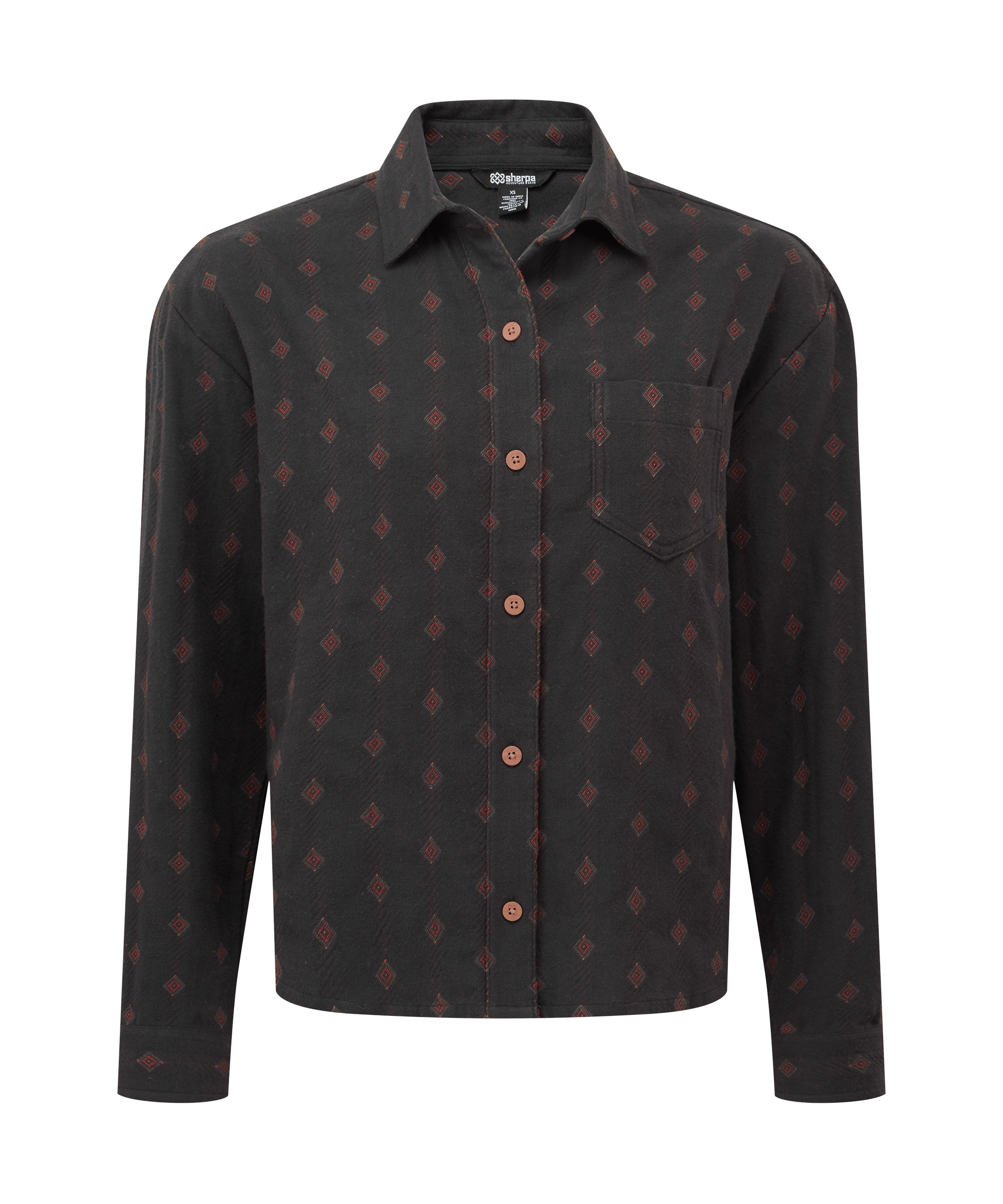 Front view of a women's Sherpa Adventure Gear long-sleeve button-up shirt in black. Features an all-over geometric print in rust tones, a pointed collar, button-front closure, and a relaxed silhouette for casual everyday wear.