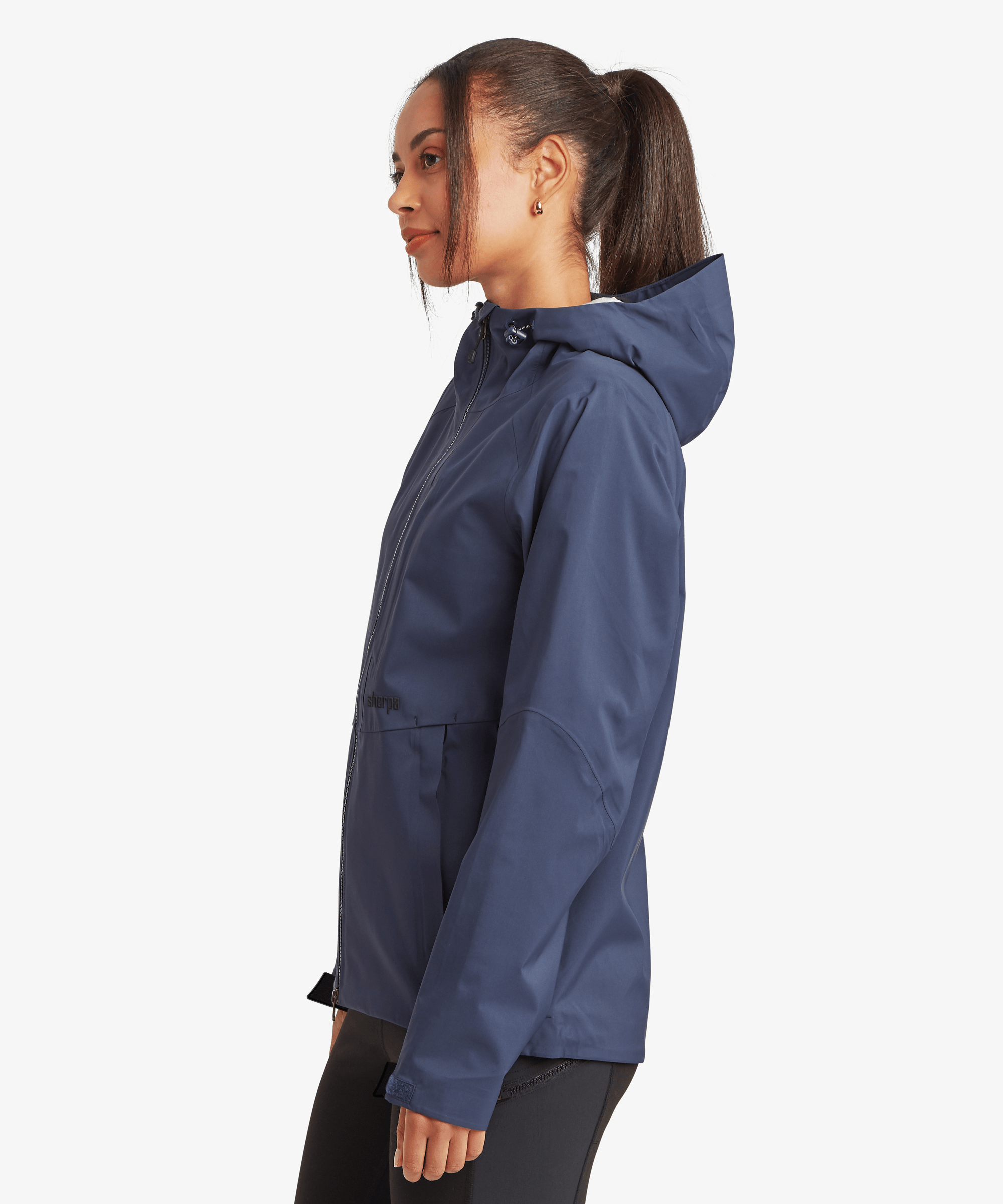 Side profile view of the Women's Beyul 3-layer jacket in blue, showing the streamlined silhouette and attached hood.