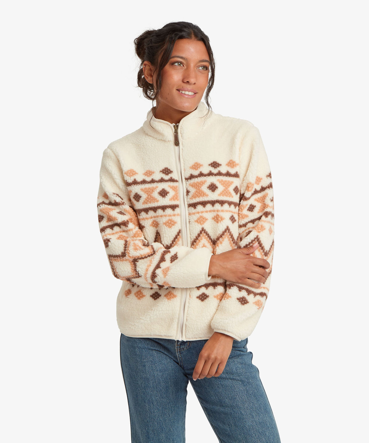 Woman wearing Sherpa Adventure Gear Gokyo Jacket in beige.