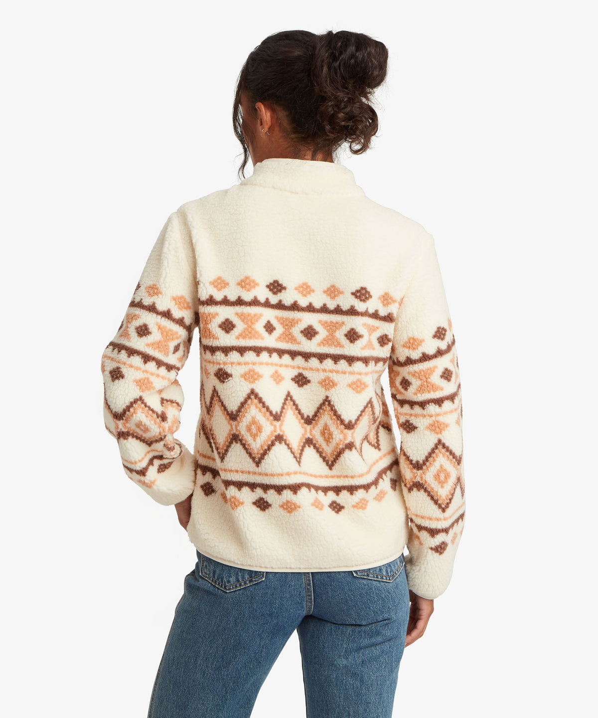 Back view of woman wearing Sherpa Adventure Gear women's Gokyo Jacket in beige.
