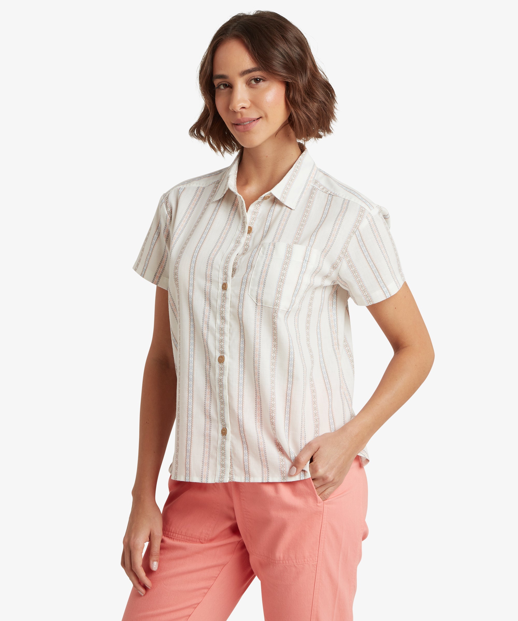 A three-quarter view of a woman wearing the striped short-sleeved shirt, highlighting the relaxed fit through the torso and shoulders. The vertical pattern and classic pointed collar add structure to the soft, breathable fabric.