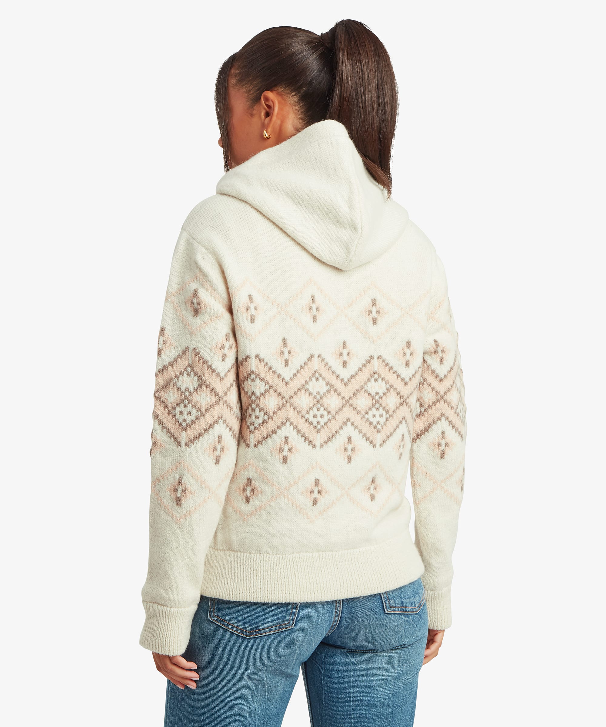Back view of a woman wearing a cream hooded sweater jacket with all-over geometric Fair Isle-inspired patterning. The image highlights the attached hood, long sleeves, and comfortable relaxed silhouette.