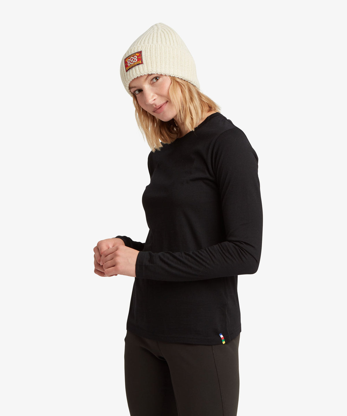 A female model wearing the Sherpa Adventure Gear womenÕs Nanda Merino Long Sleeve T-Shirt.