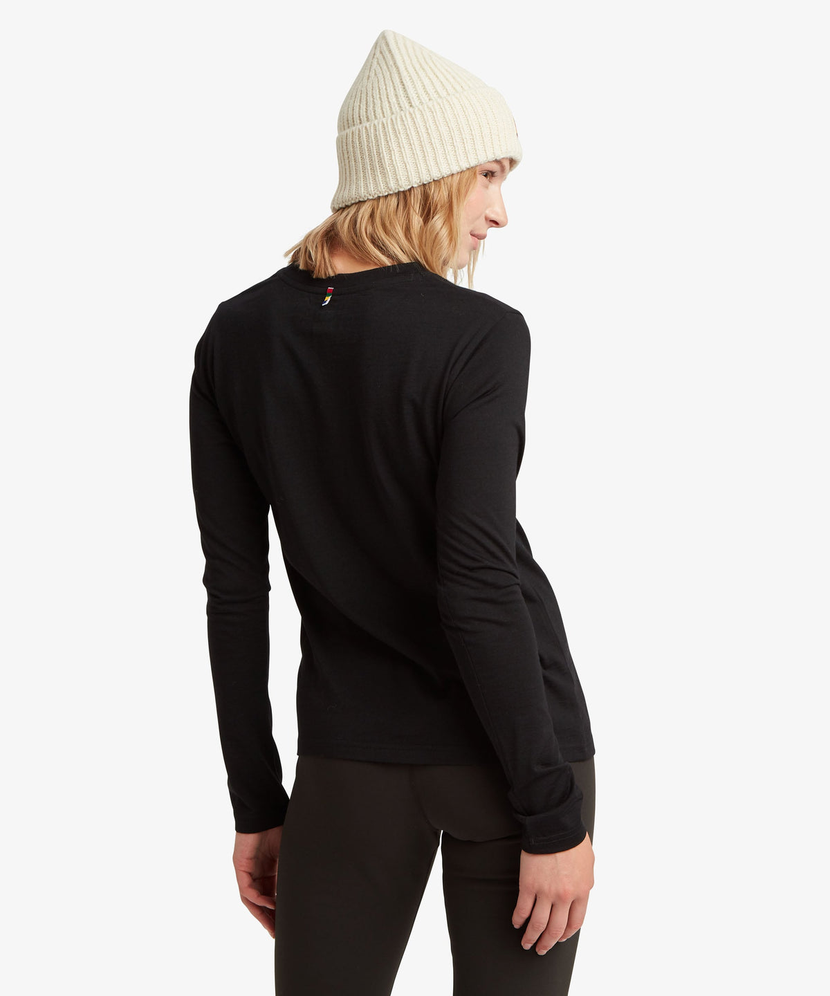 A female model wearing the Sherpa Adventure Gear womenÕs Nanda Merino Long Sleeve T-Shirt.