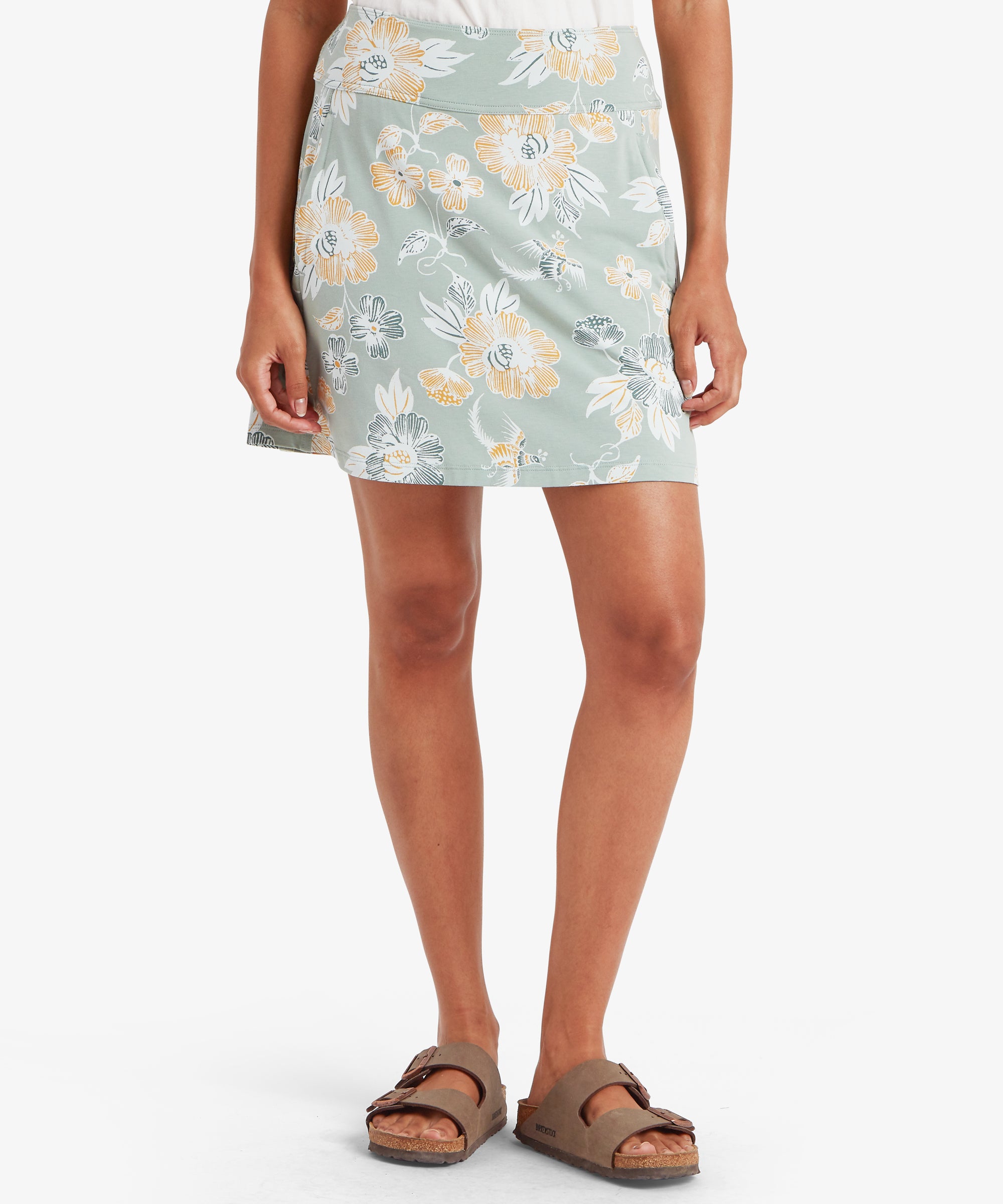 Front view close‑up of the floral skort, highlighting the placement of the large blossoms and the soft pastel background.