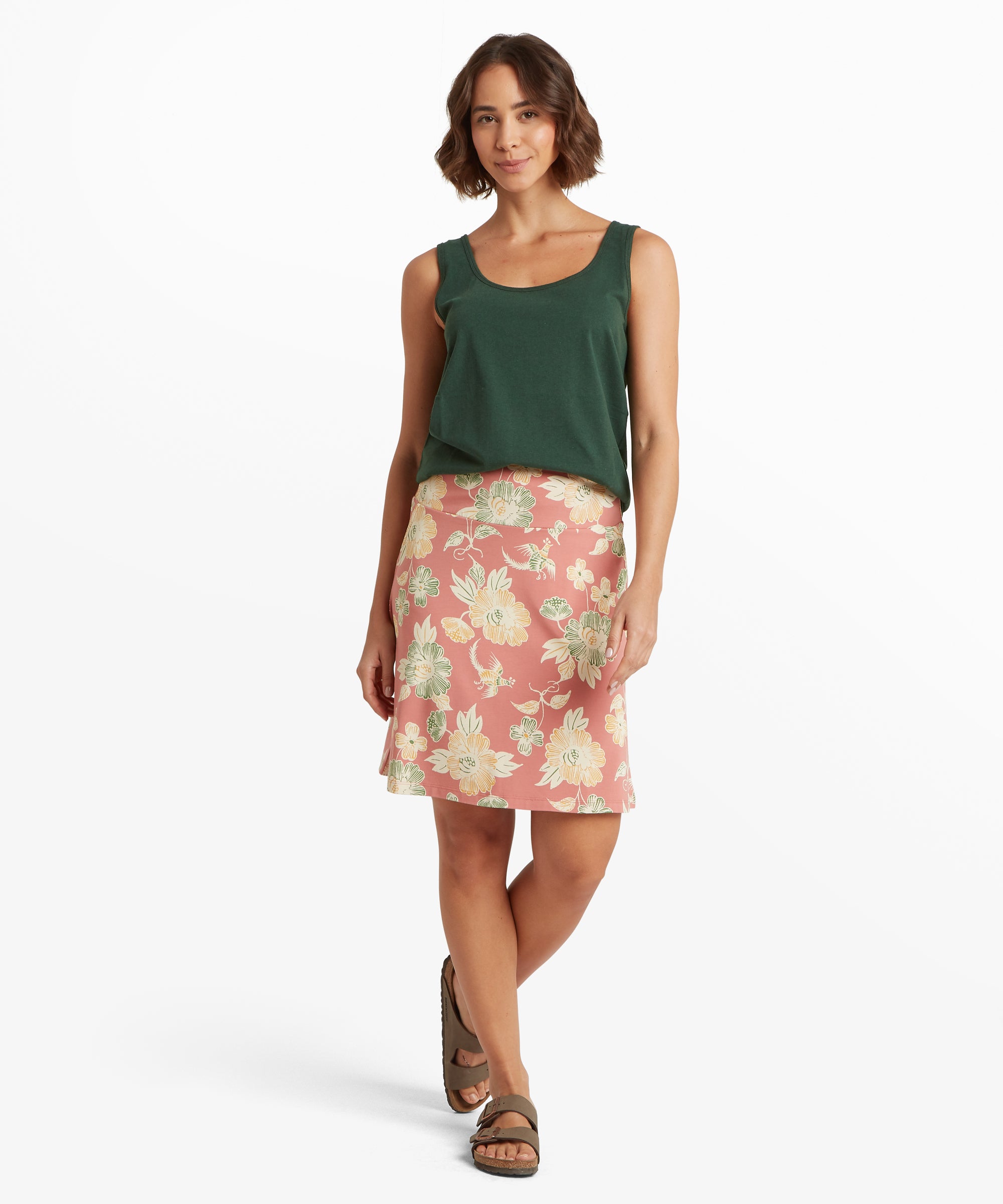 Vorderansicht eines knielangen A-Linien-Rocks mit Blumenmuster auf rosa Hintergrund, verziert mit gro§en cremefarbenen und grŸnen Blumen.