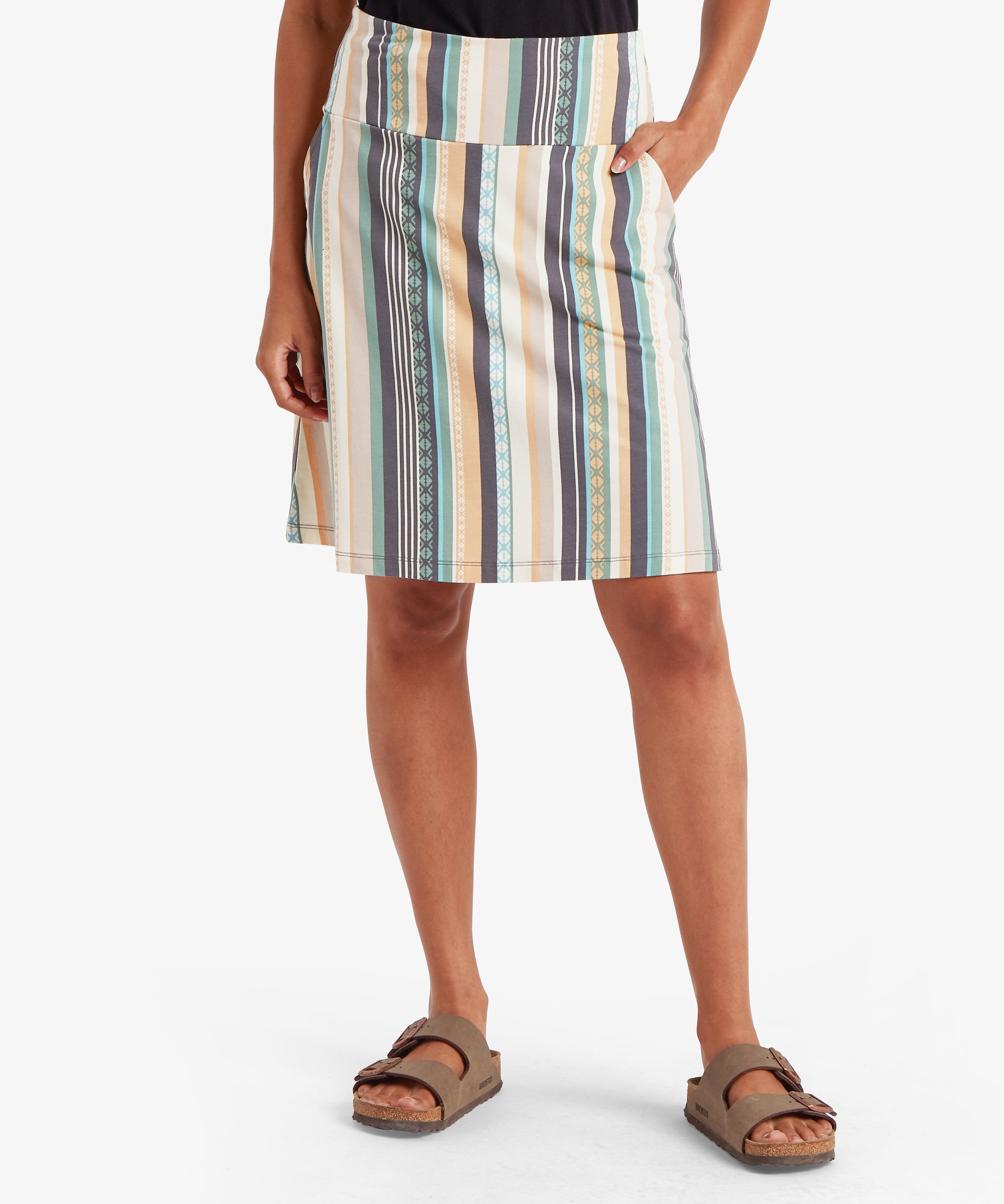 Front view of a knee-length striped A-line skirt with vertical teal, mustard, cream, and grey stripes. The skirt includes side pockets.
